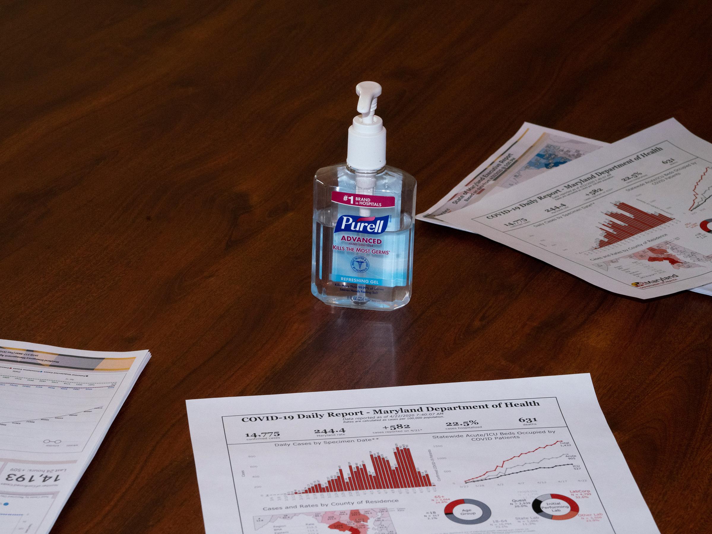 2020. USA. Annapolis, Maryland.  Purell and Corona statistics during a meeting between Governor Larry Hogan of Maryland and his staff during the Coronavirus (Covid 19) crisis.