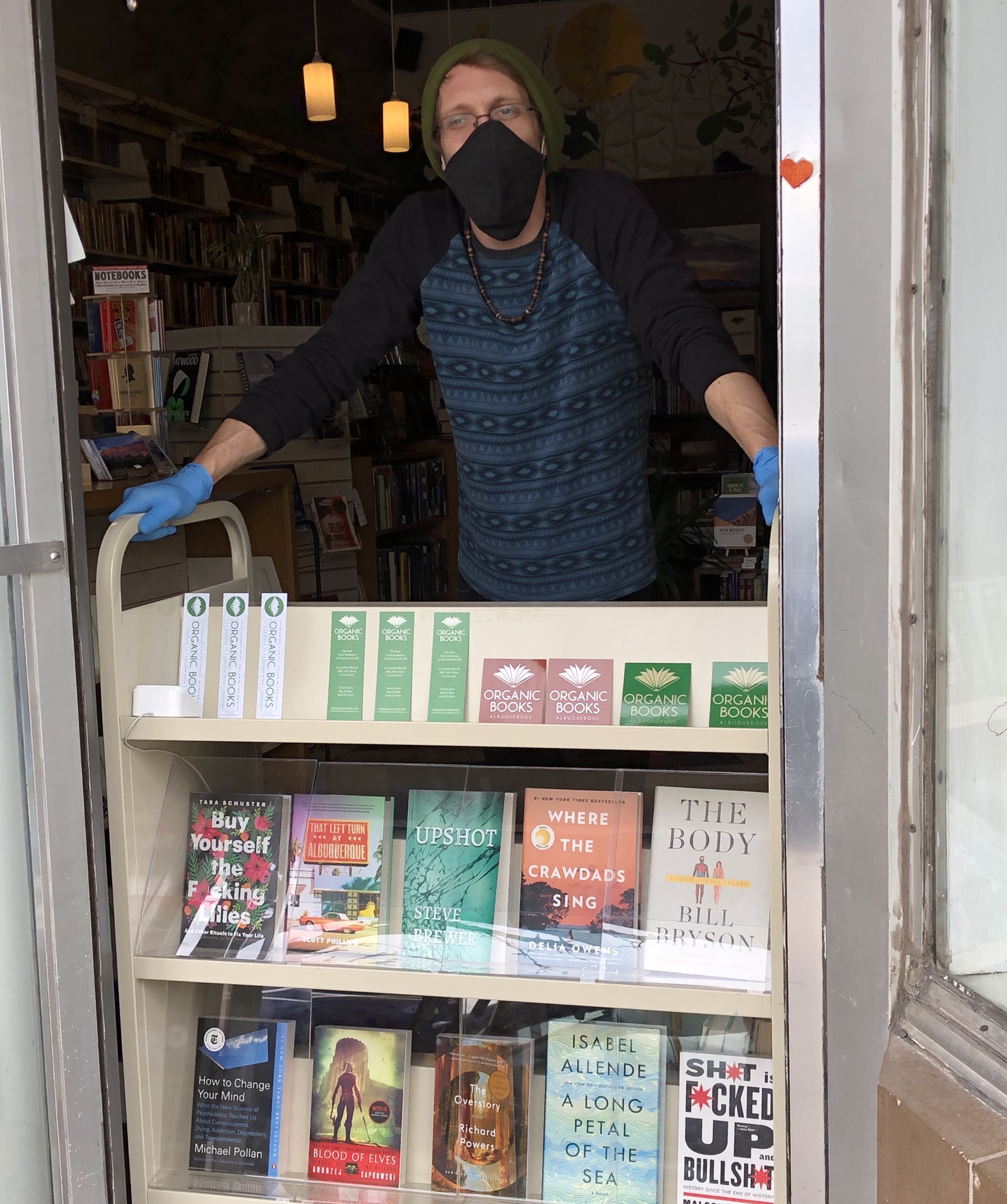 Seth Brewer, a co-owner of Organic Books in Albuquerque, New Mexico, at his bookstore before a stay-at-home order closed it down. (Kelly Brewer)