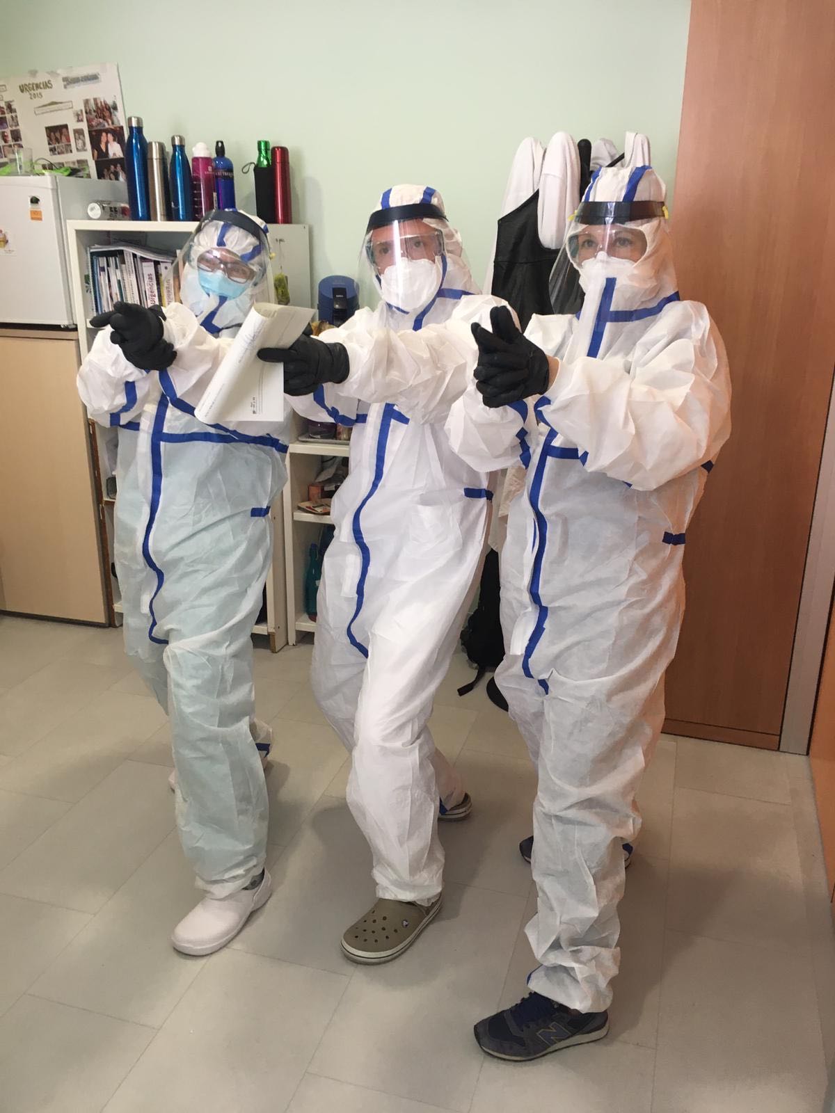 Health workers at Sara's Madrid hospital use improvised masks made of plastic screens, donated by volunteers, to protect themselves from the virus that causes COVID-19.