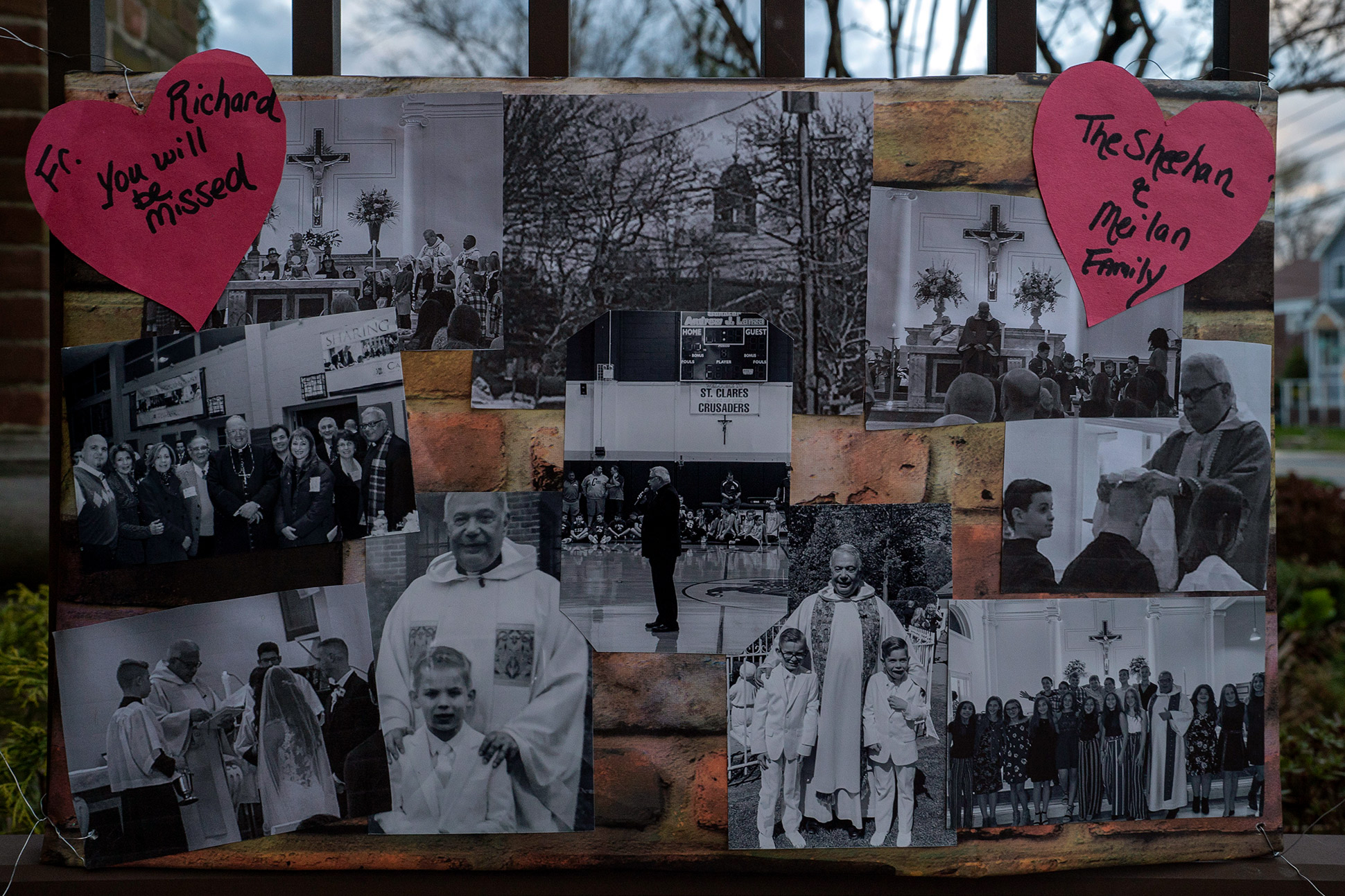 A of collage photographs left at a memorial for Monsignor Richard Guastella, who died from Covid-19 outside the doors of St. Clare Catholic Church in Staten Island, NY, April 10, 2020.