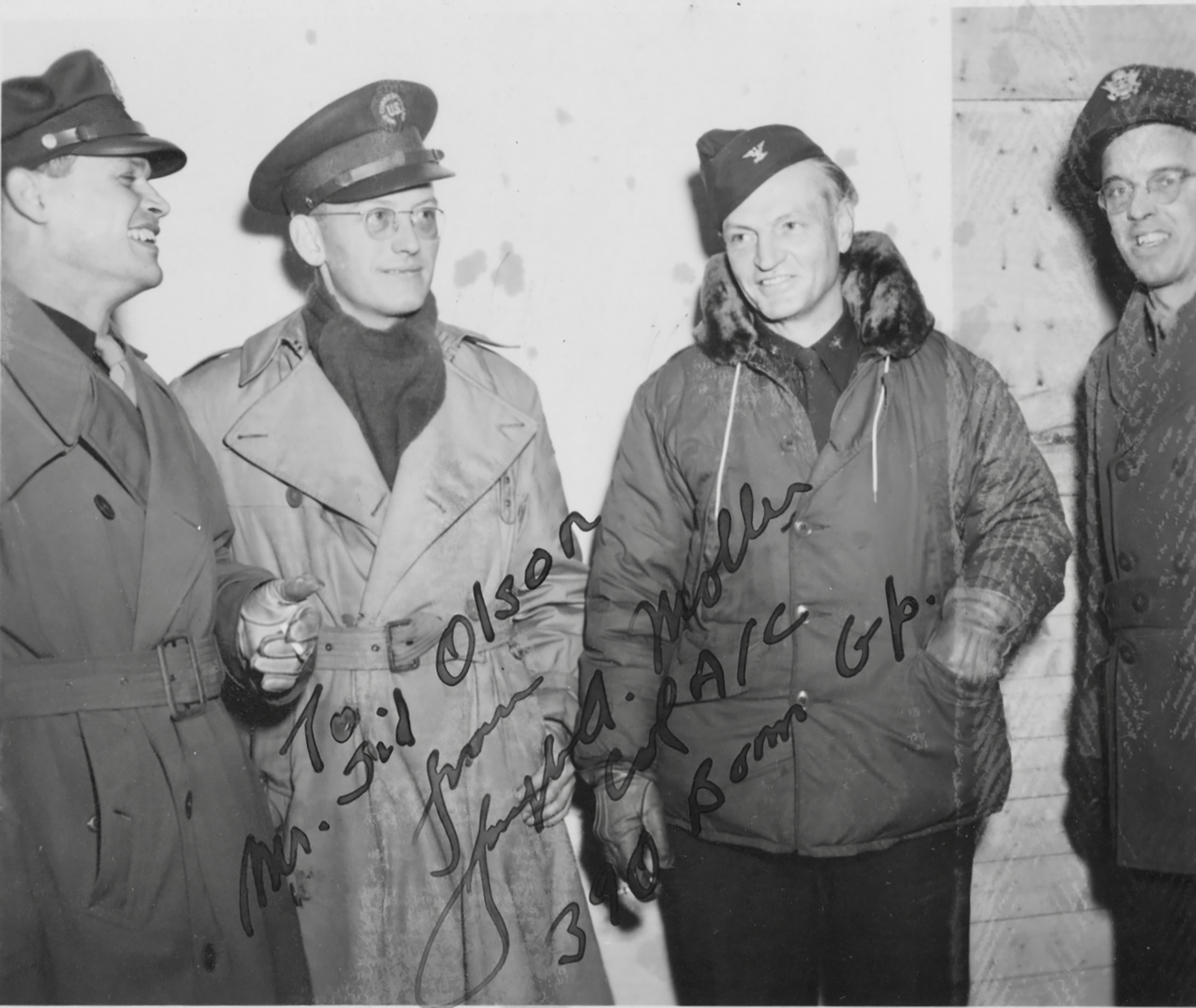 Olson (second from left) visiting U.S. troops somewhere in England in January 1945 and standing next to the 390th Bomb Group's commander Colonel Joseph A. Moller (second from right). (Courtesy of Sidney A. Olson Papers, Collection of Allen and Whitney Clark)