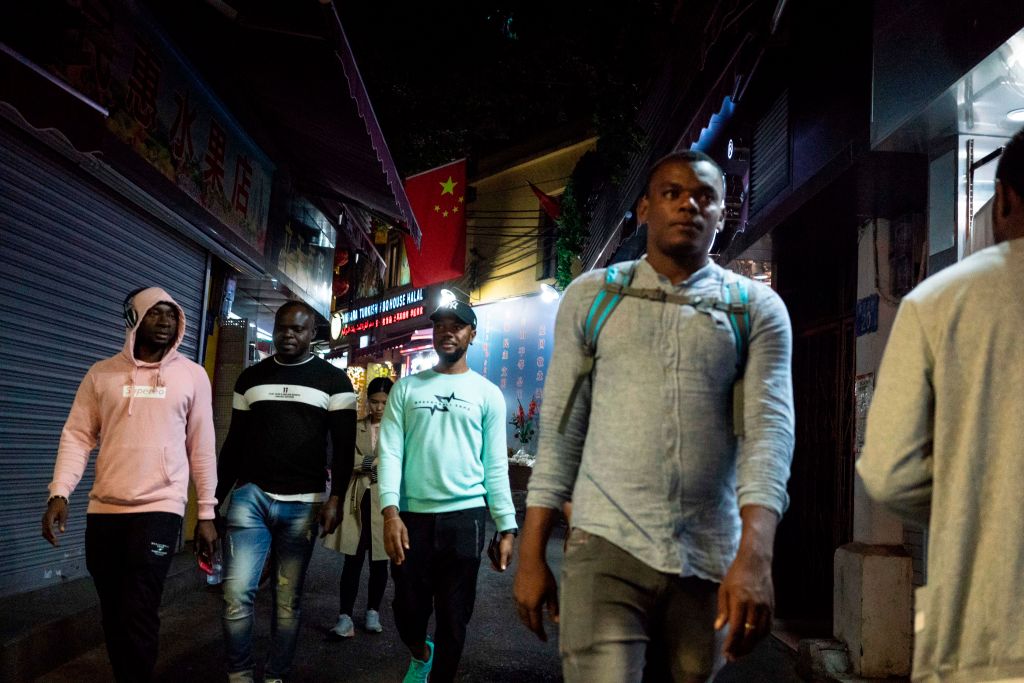 Africans walk in the "Little Africa" district of Guangzhou, China on Mar. 1, 2018. (Fred Dufour—AFP/Getty Images)