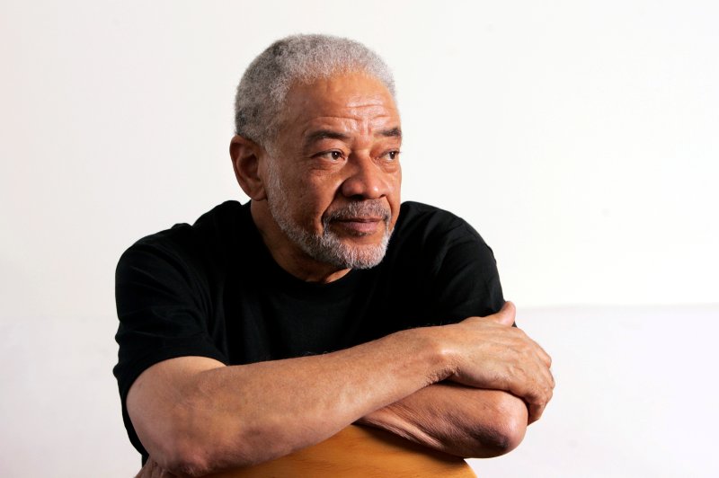 In this June 21, 2006 file photo, singer-songwriter Bill Withers poses in his office in Beverly Hills, Calif.
