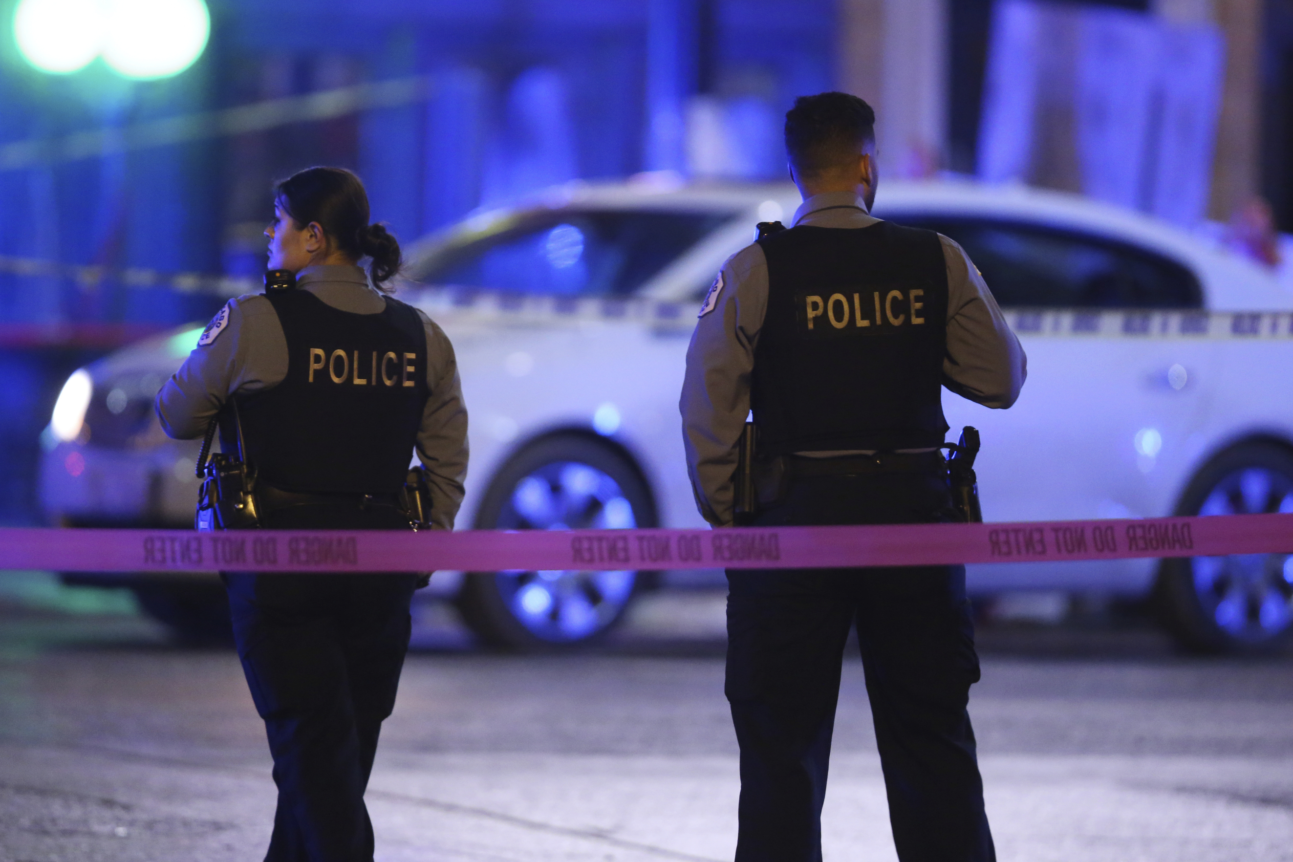 Police work a crime scene  in Chicago on Nov. 19, 2019. Despite a statewide shelter-in-place order in an attempt to stop the spread of the coronavirus, the city is still facing high levels of gun violence. (Chris Sweda—Chicago Tribune/AP)