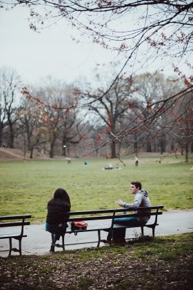 A couple having a conversation in Prospect Park, Brooklyn on April 5th, 2020.