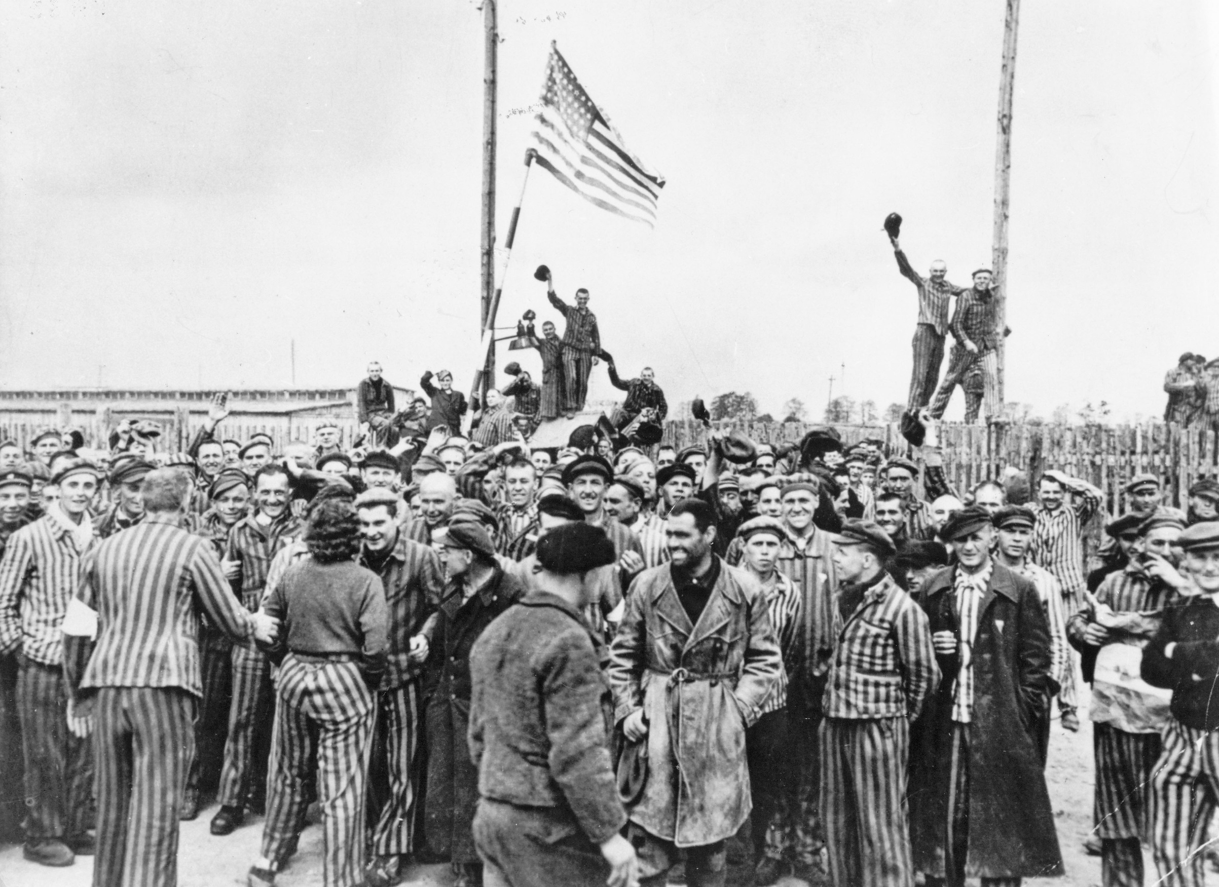 Detainees from Dachau concentration camp gathering on the former place of roll call after the liberation by American soldiers in 1945 (ullstein bild via Getty Images)