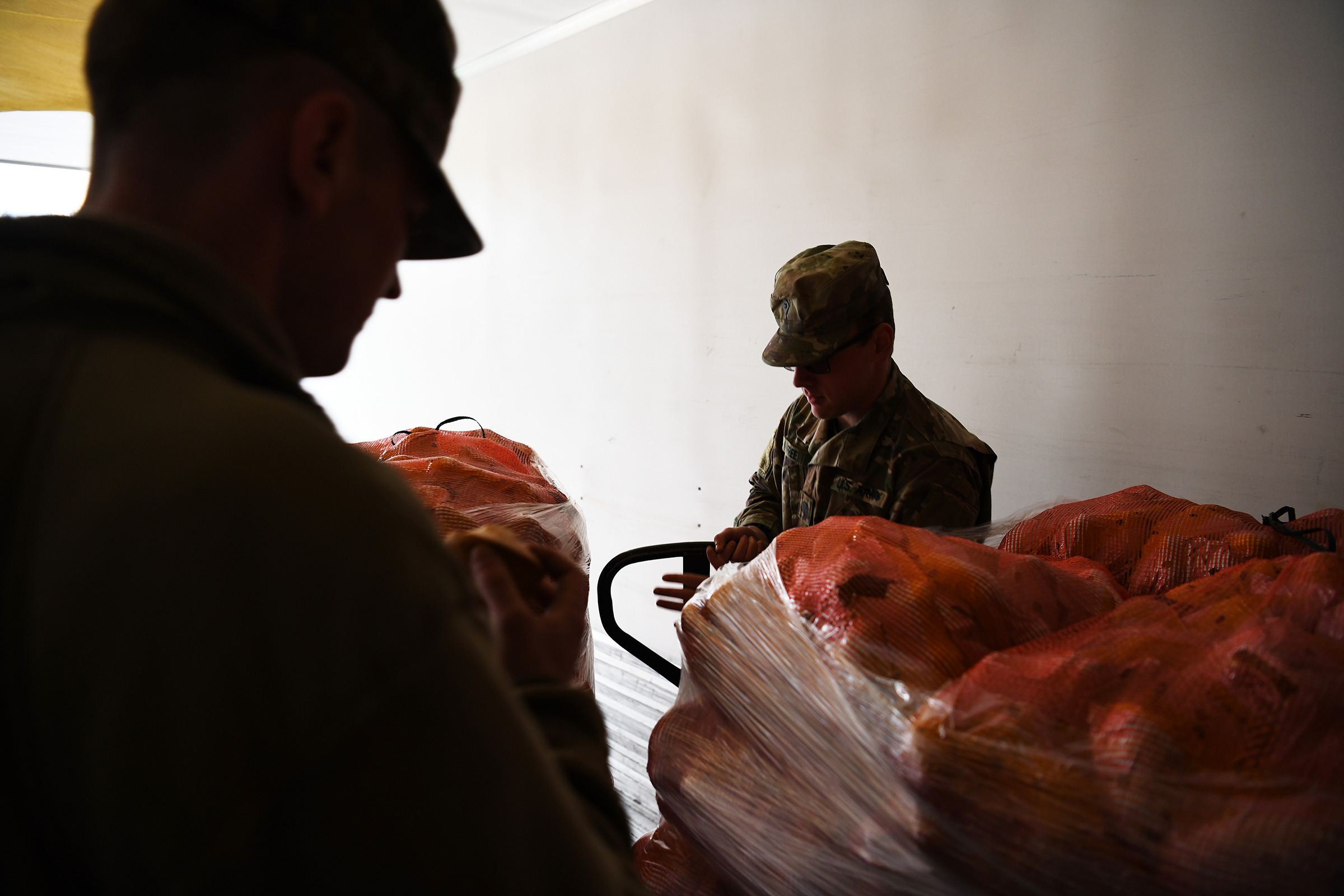 Soldiers unload food at the Dayton Foodbank in Dayton, Ohio, on April 21, 2020. (Tech Sgt. Shane Hughes—U.S. Air National Guard.)
