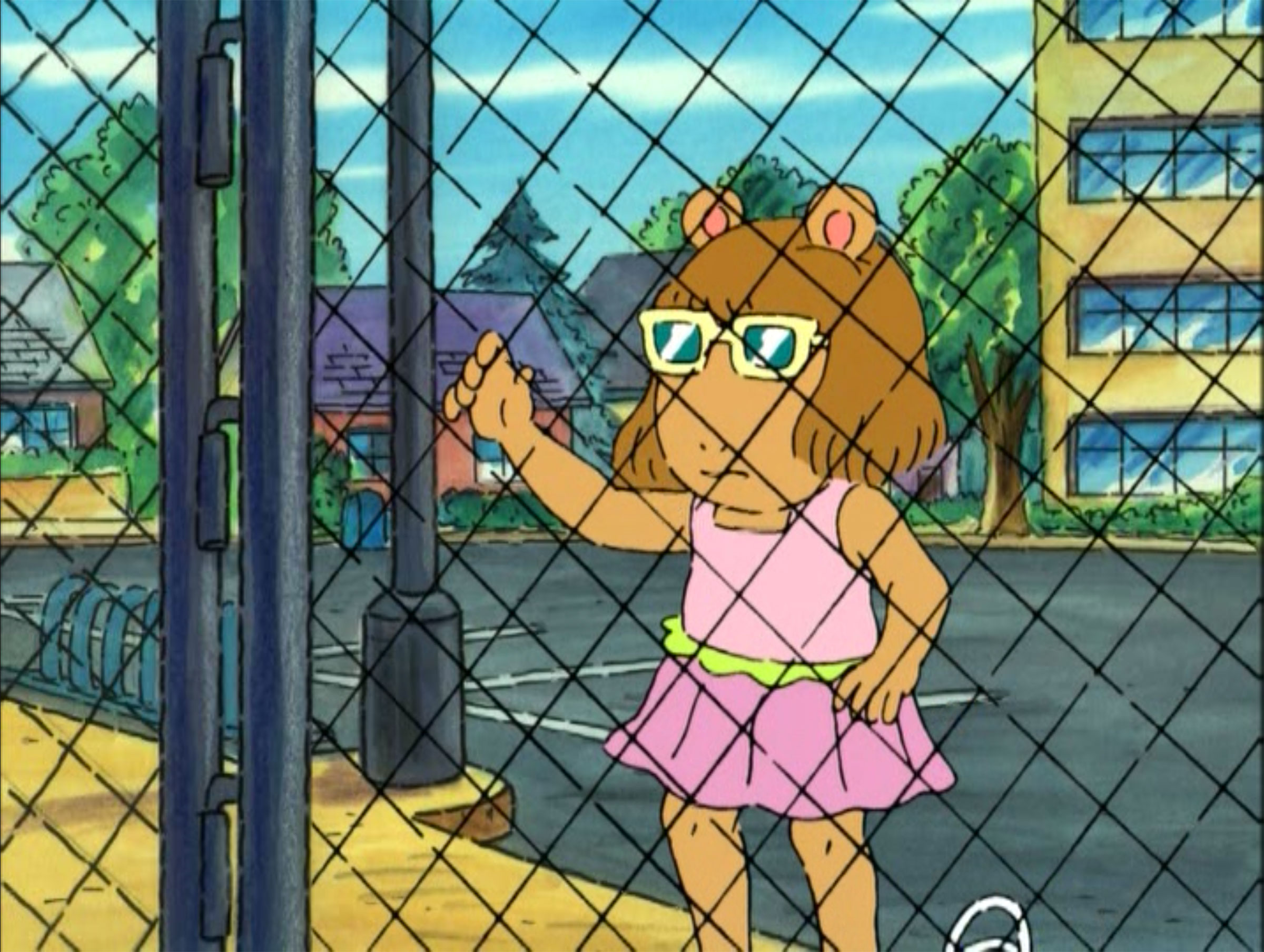A still image of the character D.W. standing at a fence in the PBS show 'Arthur'