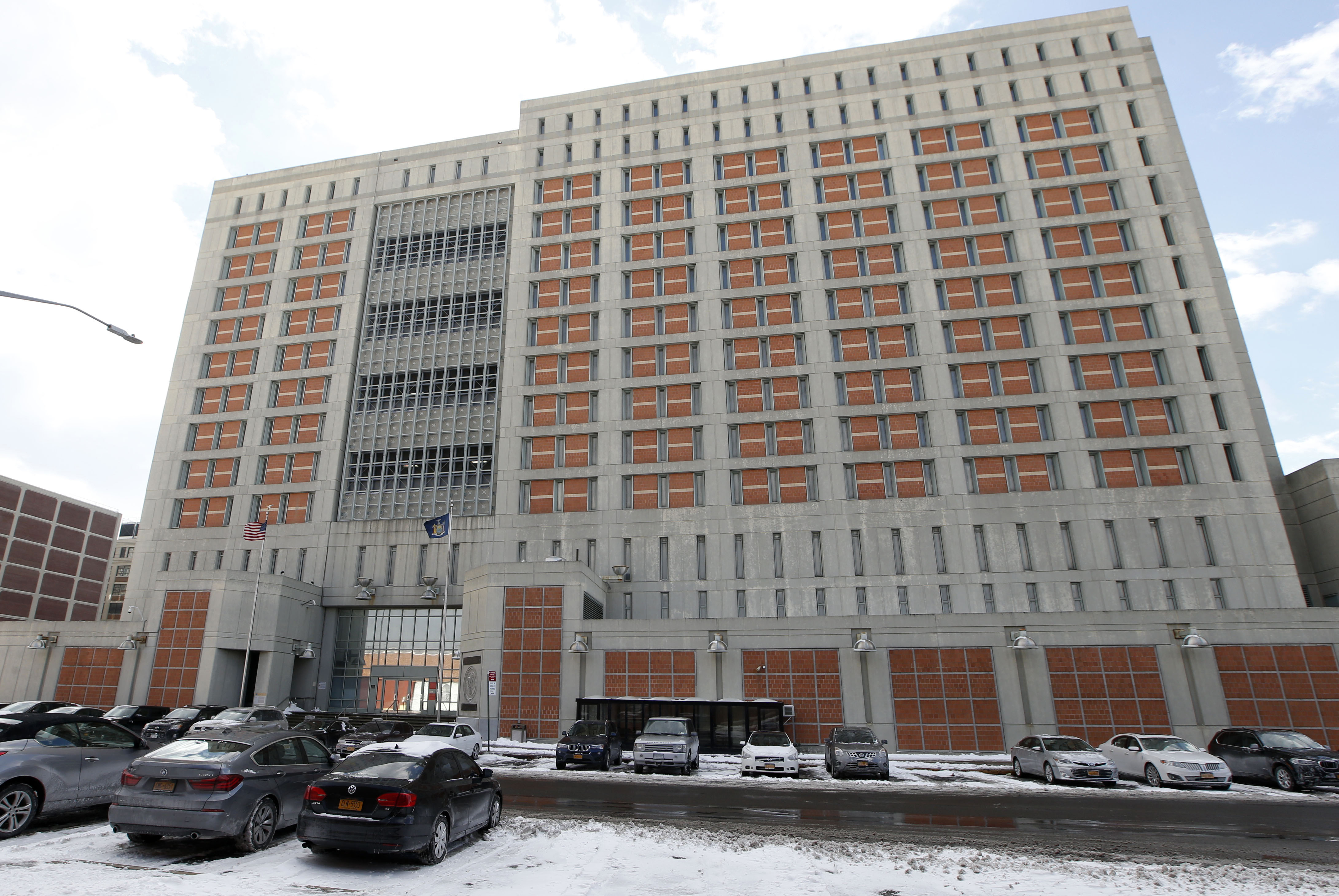 This Jan. 8, 2017 file photo shows the Metropolitan Detention Center in the Brooklyn borough of New York. The Federal Bureau of Prisons (BOP) has taken a new step in their attempt to stop the spread of coronavirus in their facilities by confining all inmates in their cells for 14 days.  (Kathy Wiliens — Associated Press)