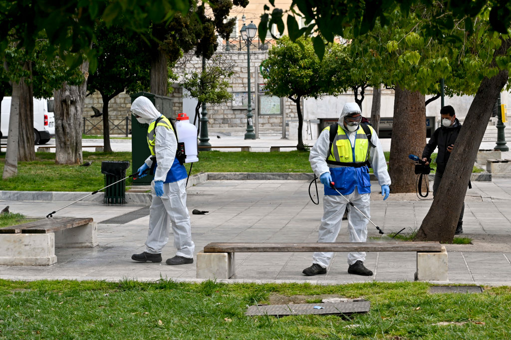 Municipal workers disinfect Syntagma square on March 23, 2020 in Athens, Greece. (Milos Bicanski/Getty Images)