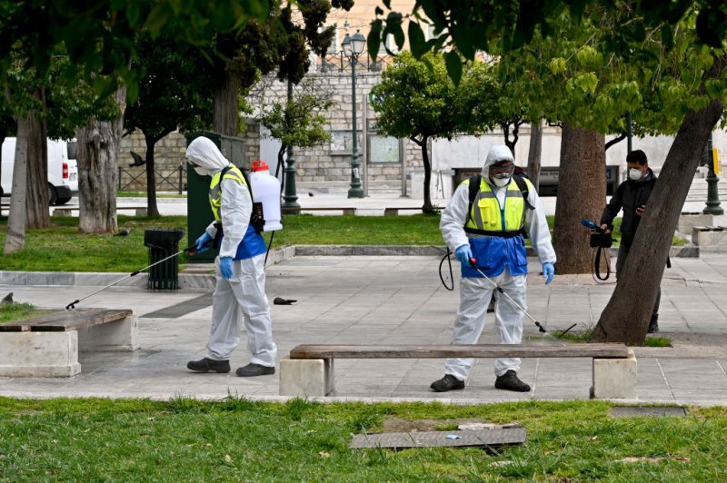 Municipal workers disinfect Syntagma square on March 23, 2020 in Athens, Greece.