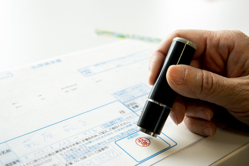 A hanko is stamped on a banking document in Tokyo, Japan, on Feb. 12, 2019. (Keith Bedford&mdash;Bloomberg/Getty Images)