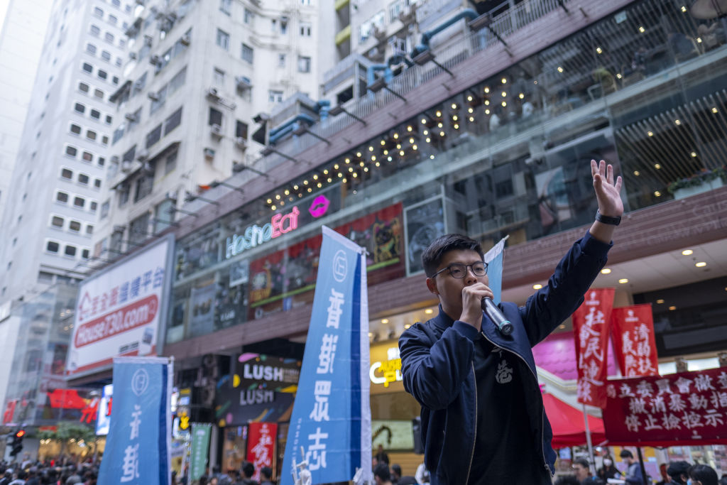 Prominent pro-democracy activist Joshua Wong speaks during a protest in Causeway Bay, Hong Kong on Jan. 1, 2020. (Justin Chin—Bloomberg/Getty Images)