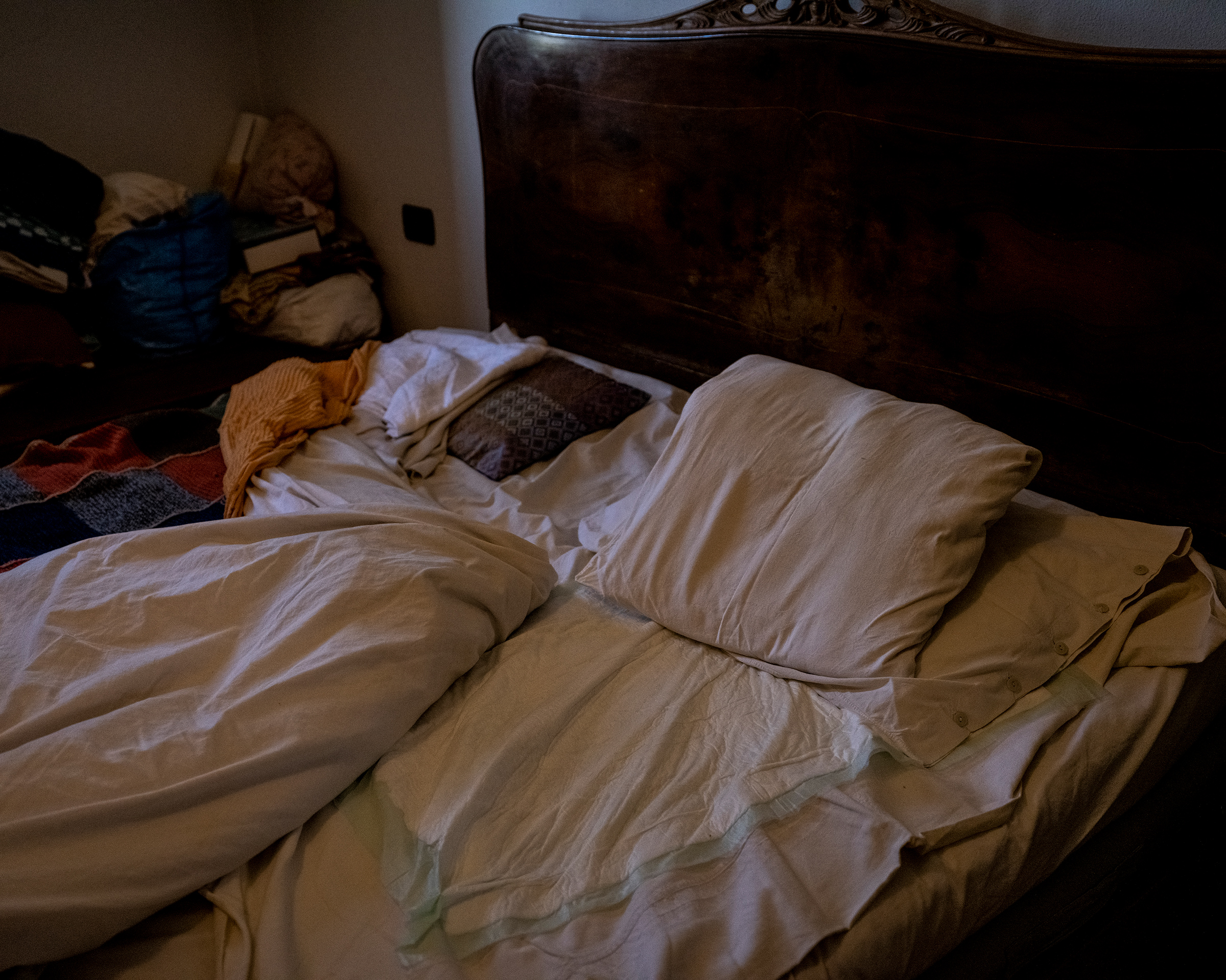 The empty bed of an elderly woman who was taken to the hospital for COVID-19 symptoms in Rossia, southeast of Milan.