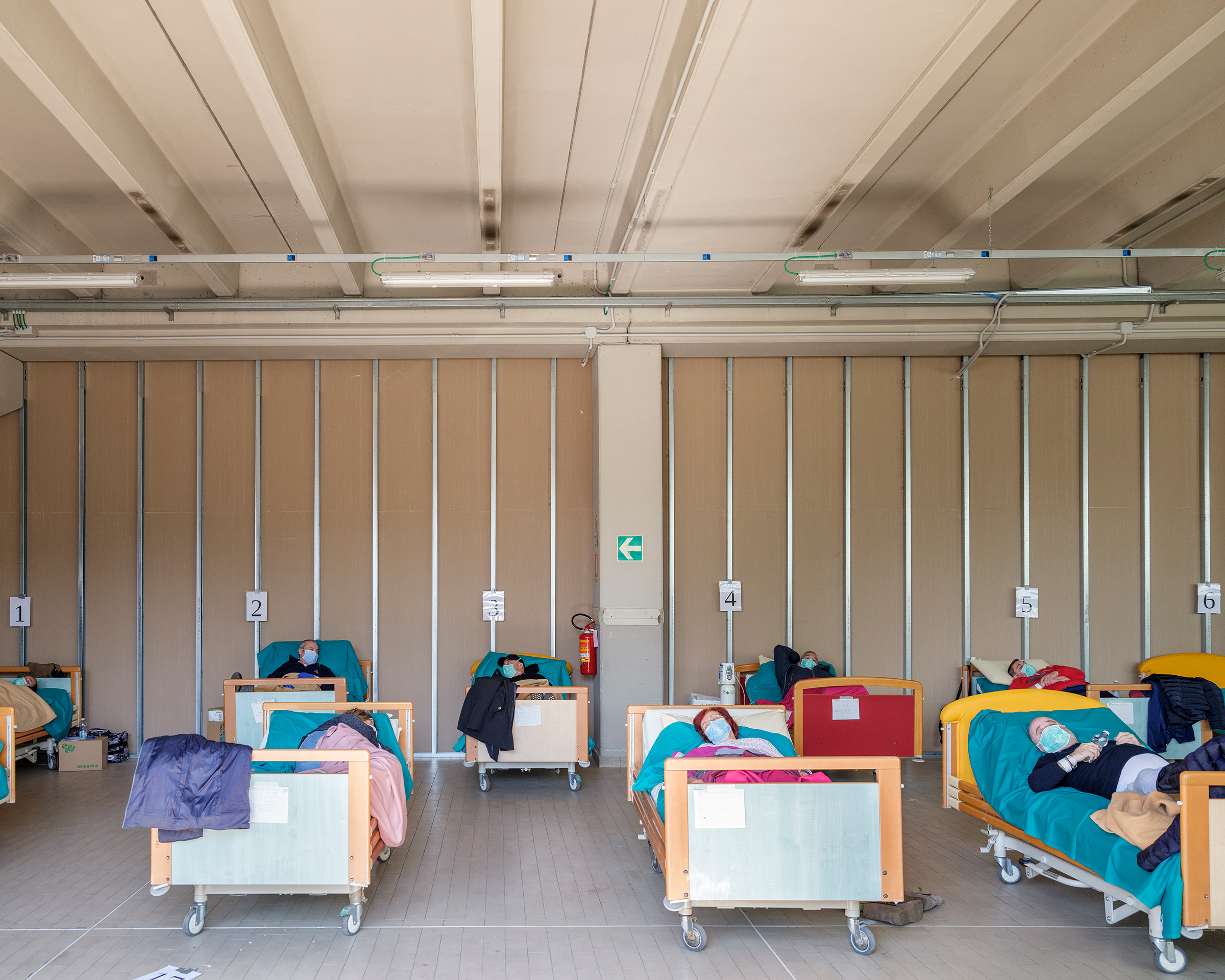Beds in a COVID-19 unit are filled at a hospital in Brescia.