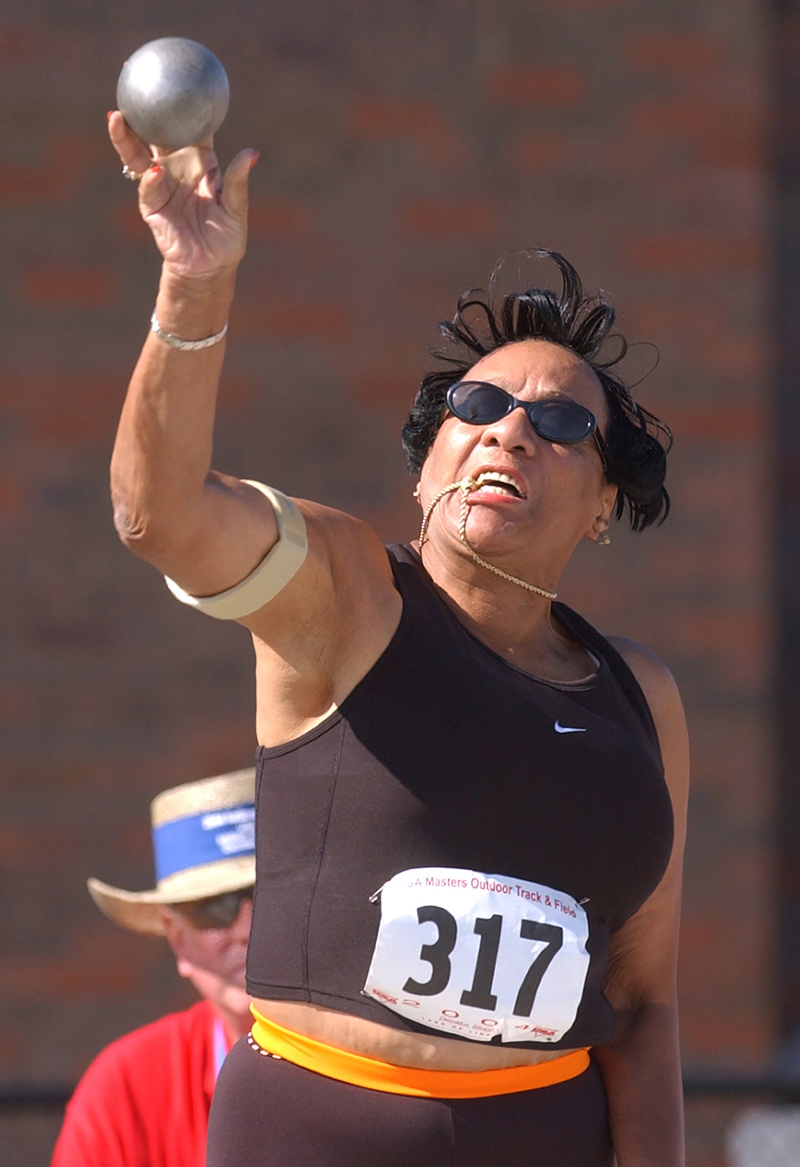 Mary Roman, of Norwalk, CT makes a shot put attempt on Aug. 5, 2004, at the USA Masters Outdoor Track &amp; Field competition in Decatur, Ill.