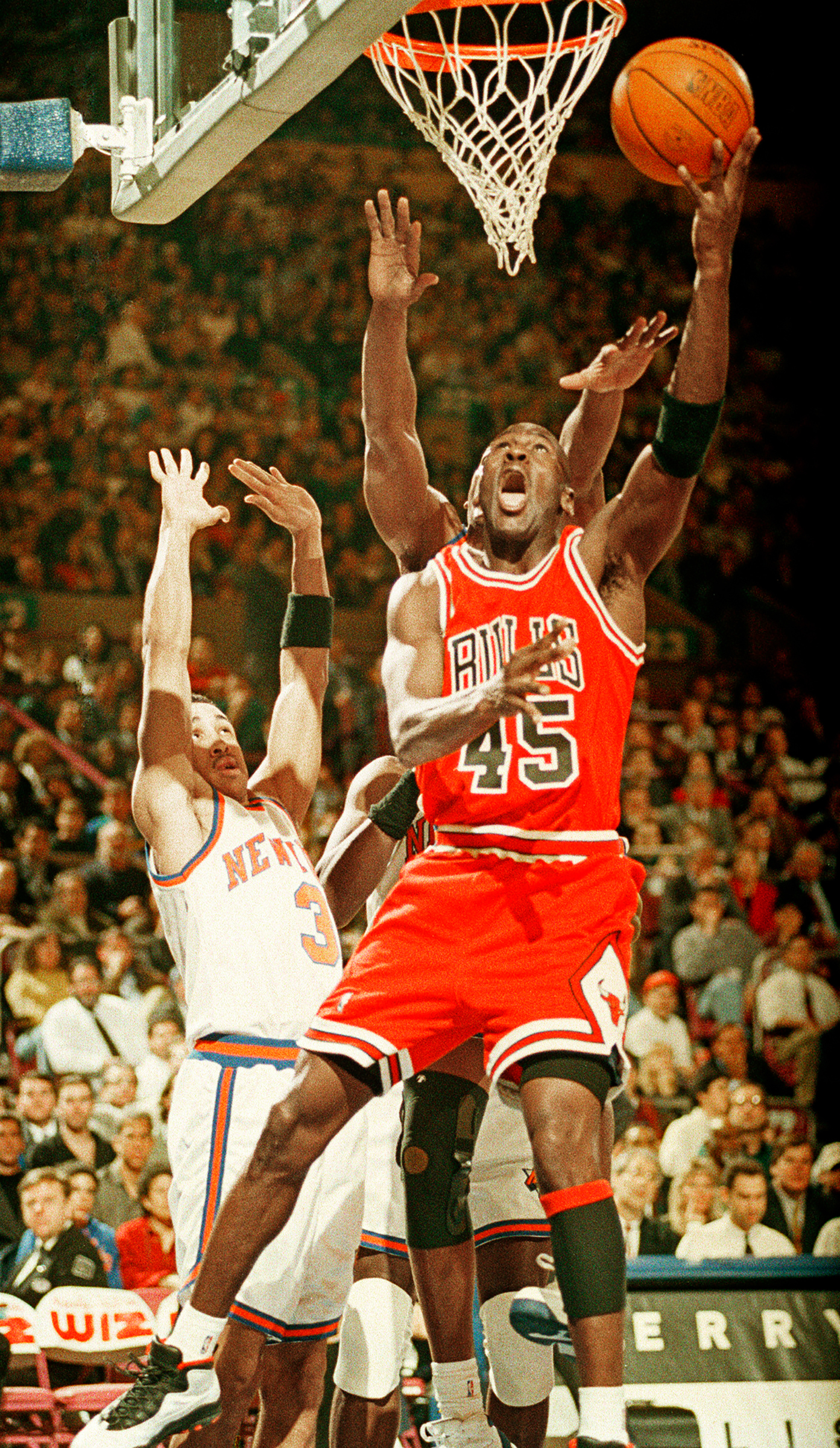 Michael Jordan scores 55 points vs. New York, while wearing No. 45, upon returning to the NBA in 1995. (Ron Frehm—AP)