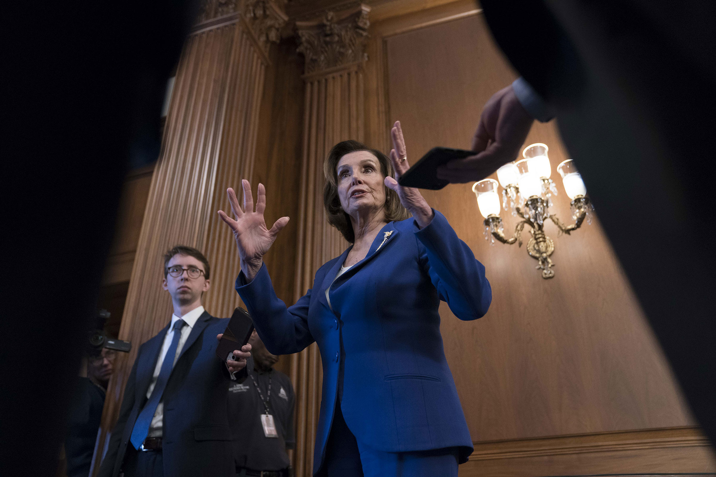 Pelosi, addressing the media on March 27, has been at the center of a rare burst of bipartisan legislation