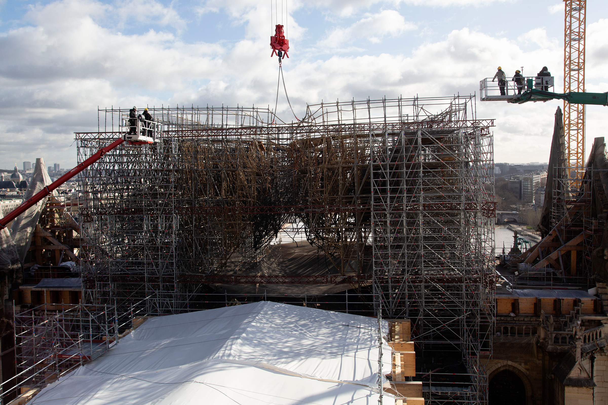 The most complicated reconstruction task is dismantling the twisted scaffolding, seen in February, that sits atop the cathedral. (Patrick Zachmann—Magnum Photos for TIME)