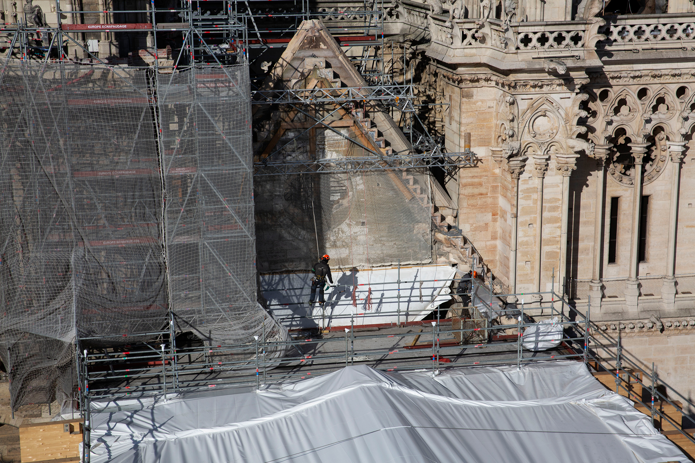 Macron's ambitious time frame for reopening Notre-Dame, seen in February, galvanized people into action and brought pledges of nearly a billion euros in donations for the reconstruction.
