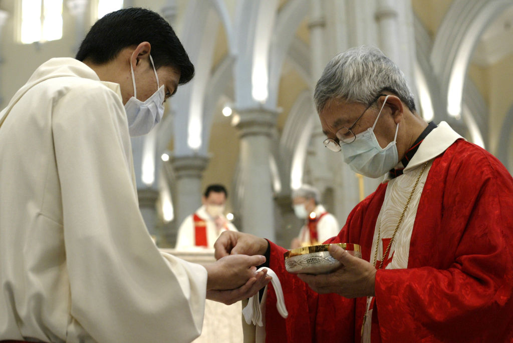 Hong Kong's Catholic Bishop Joseph Zen Ze-kiun attends a pre-Easter Mass at the Catholic Cathedral in the Mid Levels neighborhood of Hong Kong on April 17, 2003. (Dustin Shum/South China Morning Post —Getty Images)