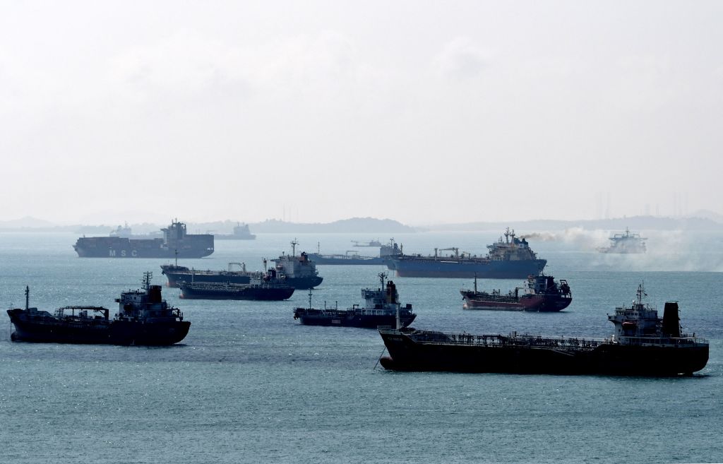 This photograph taken on February 19, 2018 shows oil tankers anchored off the western shores of Singapore. (Roslan Rahman–AFP/Getty Images)