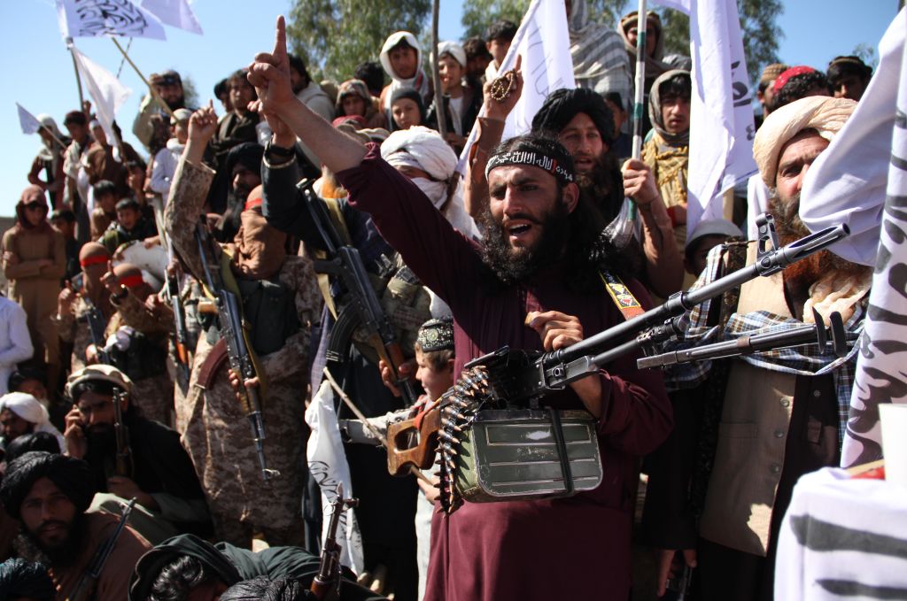 Afghan Taliban fighters and villagers attend a gathering as they celebrate the peace deal signed between the U.S. and the Taliban in Laghman Province on March 2, 2020. (Wali Sabawoon—NurPhoto/Getty Images)