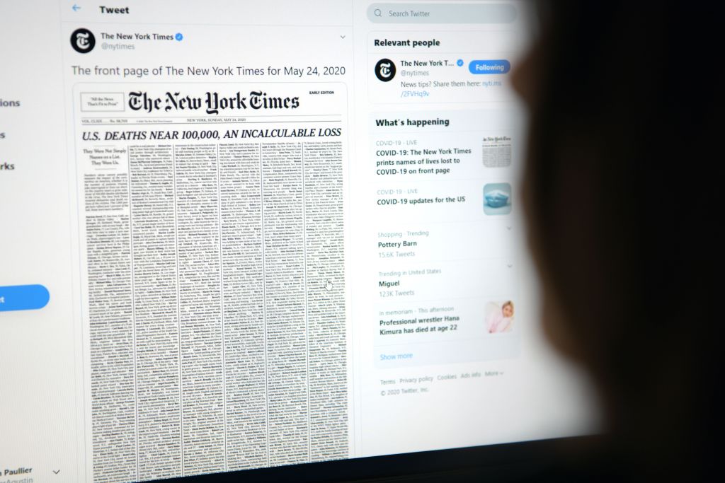 A woman looking at a computer screen with a tweet by the New York Times newspaper account showing the early edition front page of May 24, May 23, in Los Angeles, Calif. (Agustin Paullier—AFP via Getty Images)