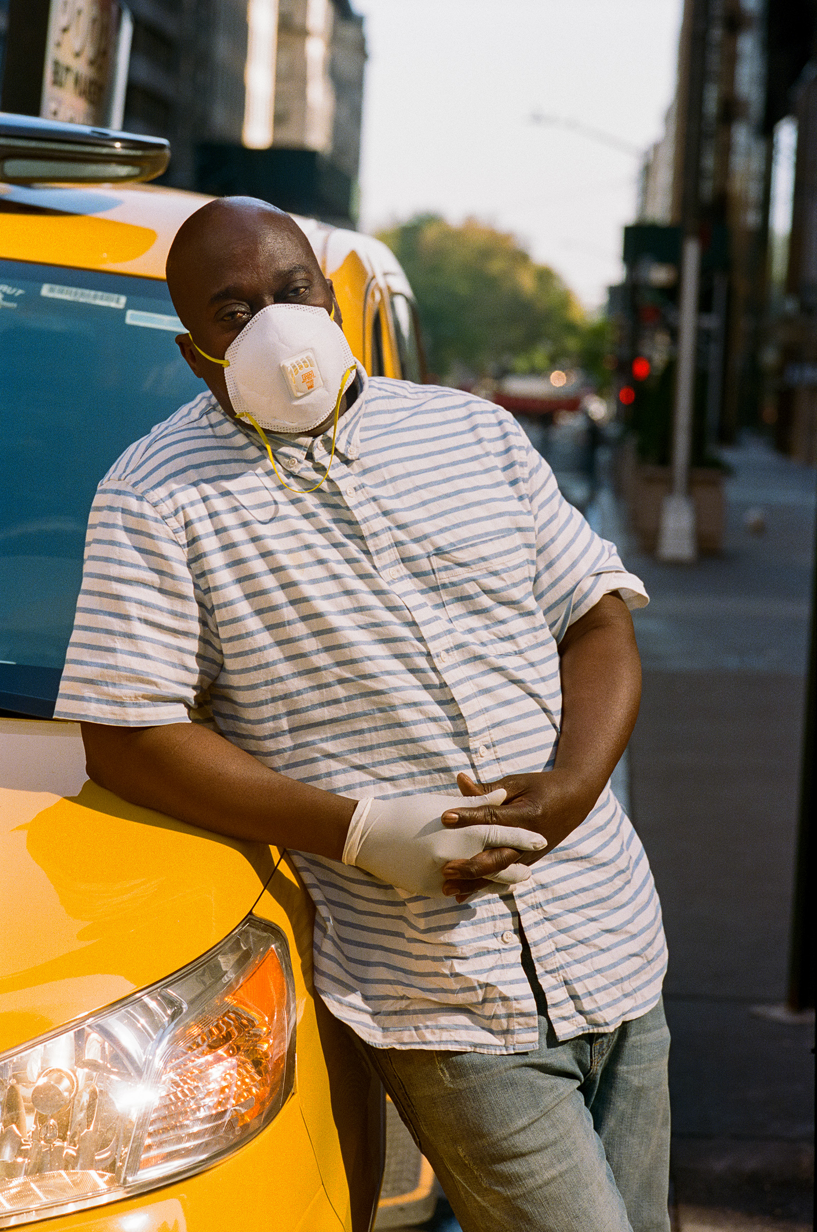 Taxi drivers, like Jacob Smith, pick up many passengers from hospitals and have to buy their own face masks, sanitizers and gloves. "I’m more cautious," Smith says. (Andre D. Wagner for TIME)