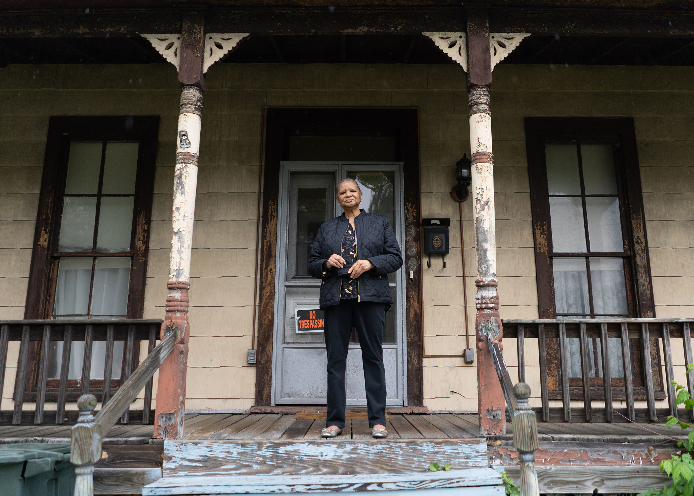 Brightwood resident, Carol Lightfoot, 73, stands on her front porch in Northwest Washington, DC.
