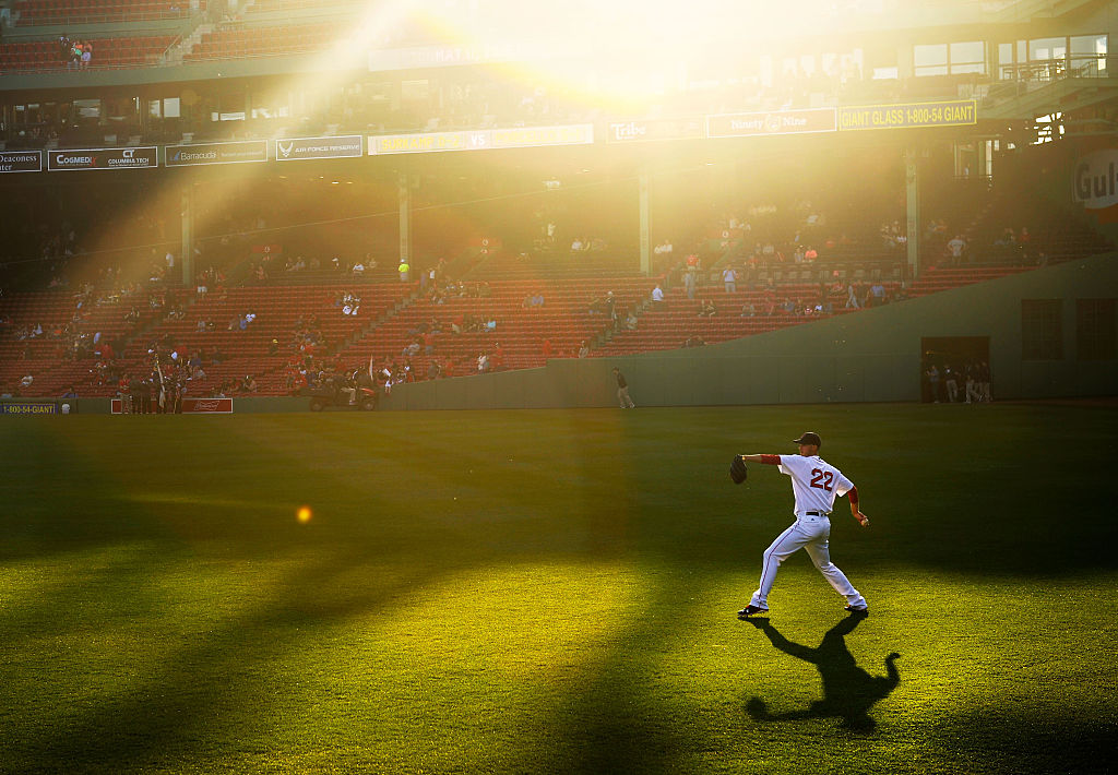 Rick Porcello #22 of the Boston Red Sox warms up in center field before the game against the Oakland Athletics at Fenway Park on May 11, 2016 in Boston, Massachusetts. (Adam Glanzman — Getty Images)