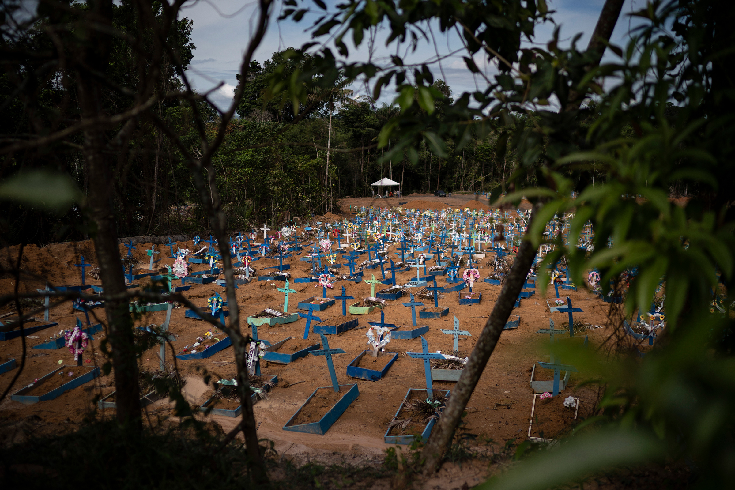 Graves of people who died in the past 30 days fill a new section of the Nossa Senhora Aparecida cemetery in Manaus, Brazil, on May 11, 2020. The new section was opened last month to cope with a sudden surge in deaths.