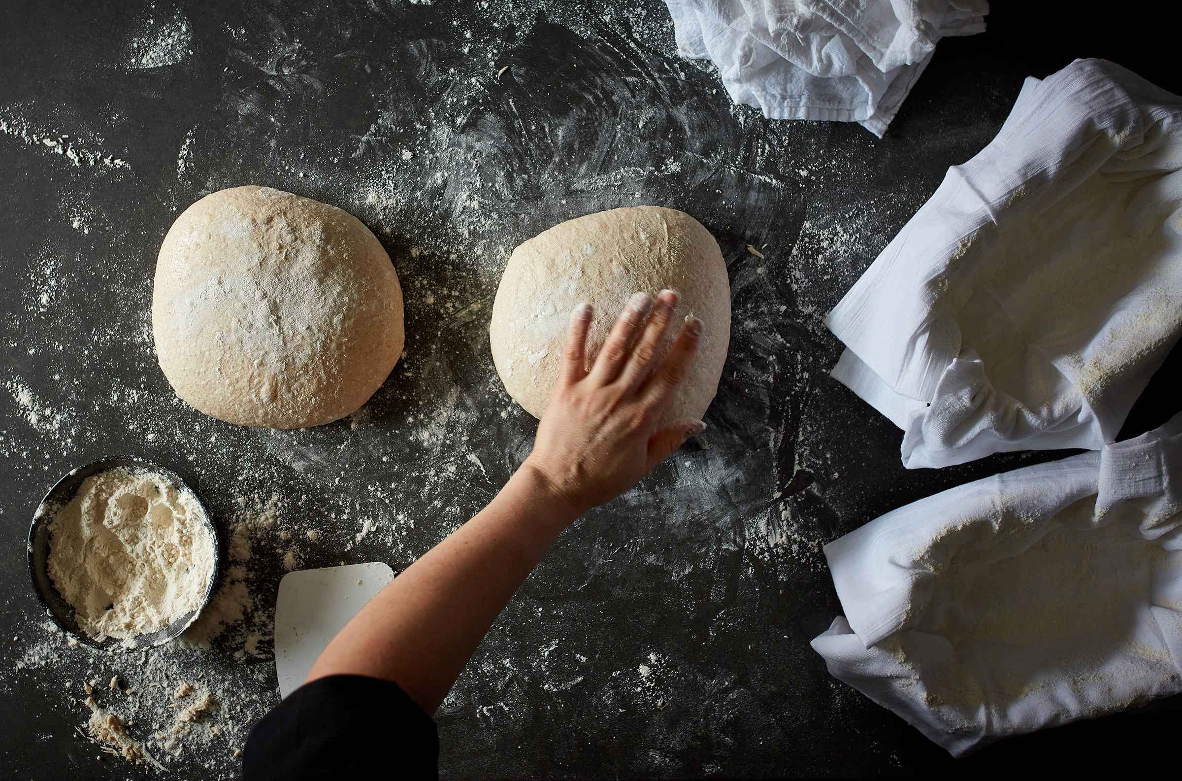 Dough is shaped for sourdough bread in New York, Sept. 10, 2019. Food Stylist: Laurie Pellicano. (Johnny Miller/The New York Times