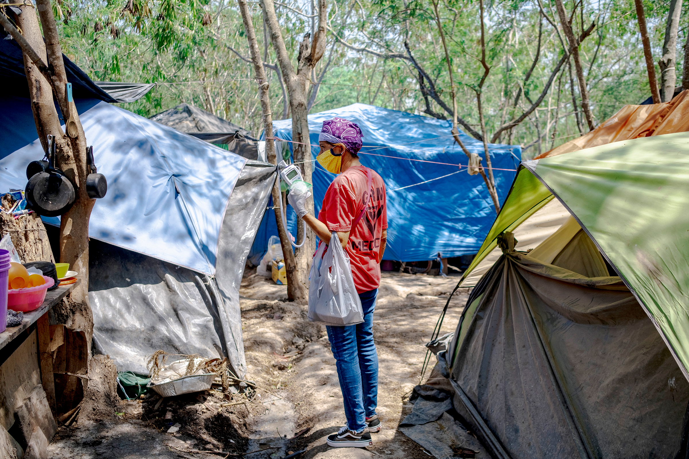 A member of the Global Responses Management medical team in the camp on April 24. "Social distancing and quarantine in refugee situations is nearly impossible," says Helen Perry, an acute care nurse practitioner and executive director of GRM.