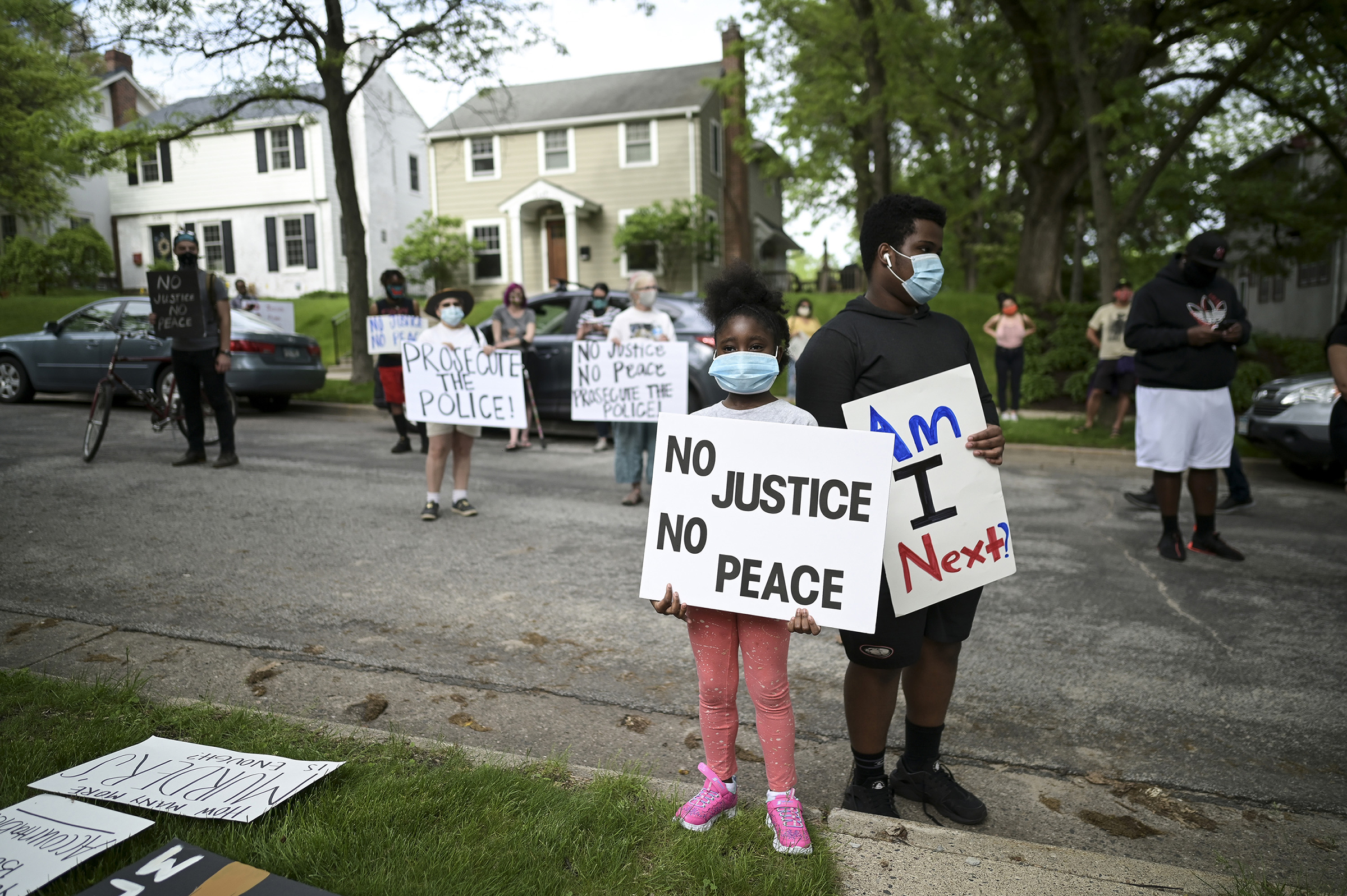 Deshawn Williams, 15, and his sister, Sarah Newell, 7, protest outside Hennepin County Attorney Mike Freeman's home in Minneapolis on May 27. (Aaron Lavinsky—Star Tribune/Sipa USA)