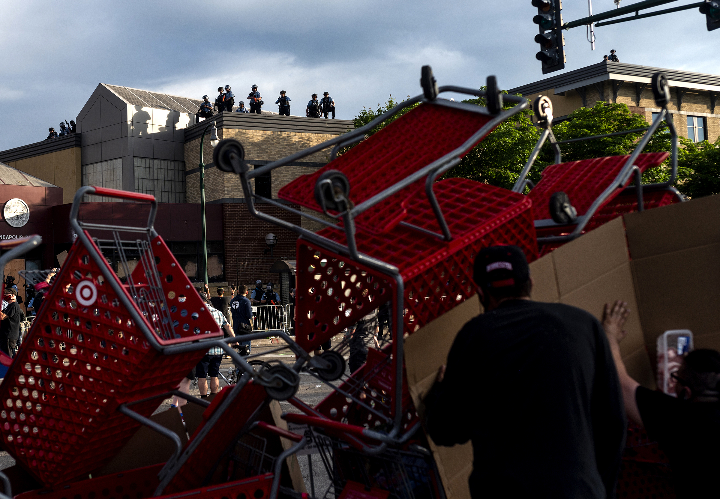 Protesters use shopping carts as a barricade as they confront police near the 3rd precinct on May 27. (Stephen Maturen—Getty Images)