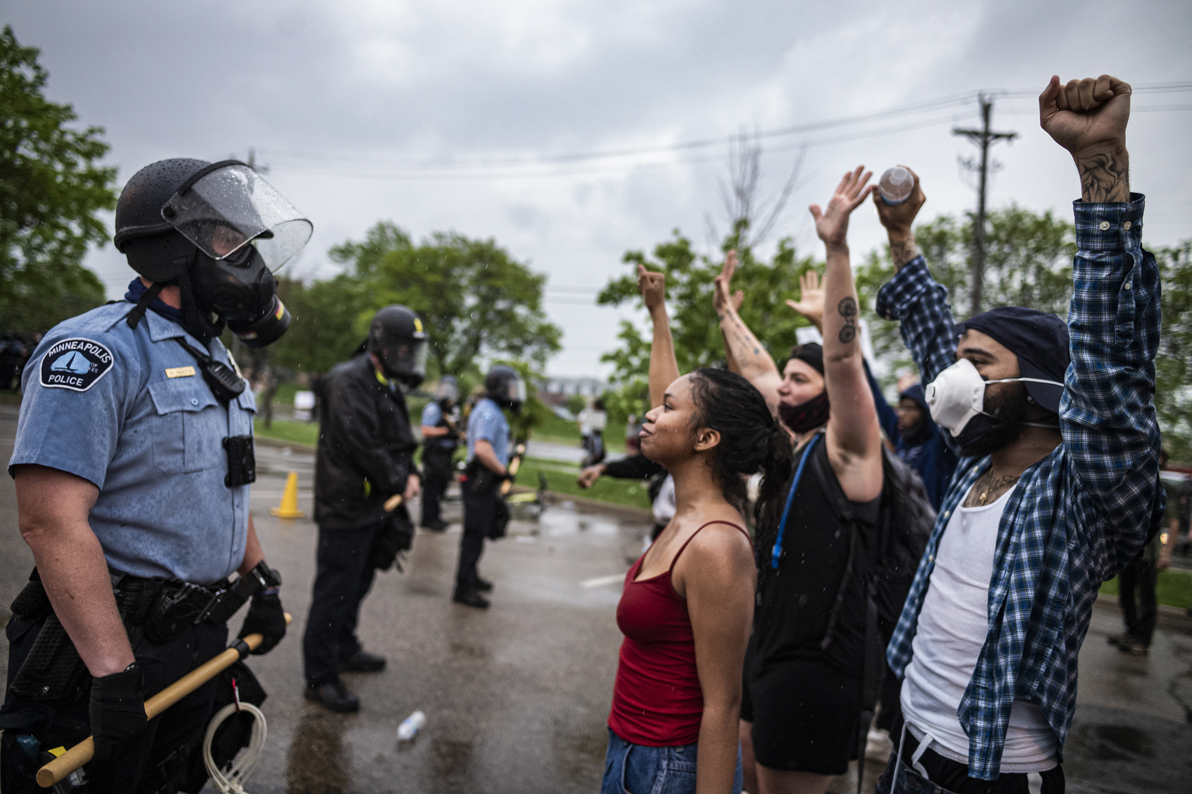 People face off with police near the 3rd precinct in Minneapolis on May 26. (Richard Tsong-Taatarii—Star Tribune/Getty Images)