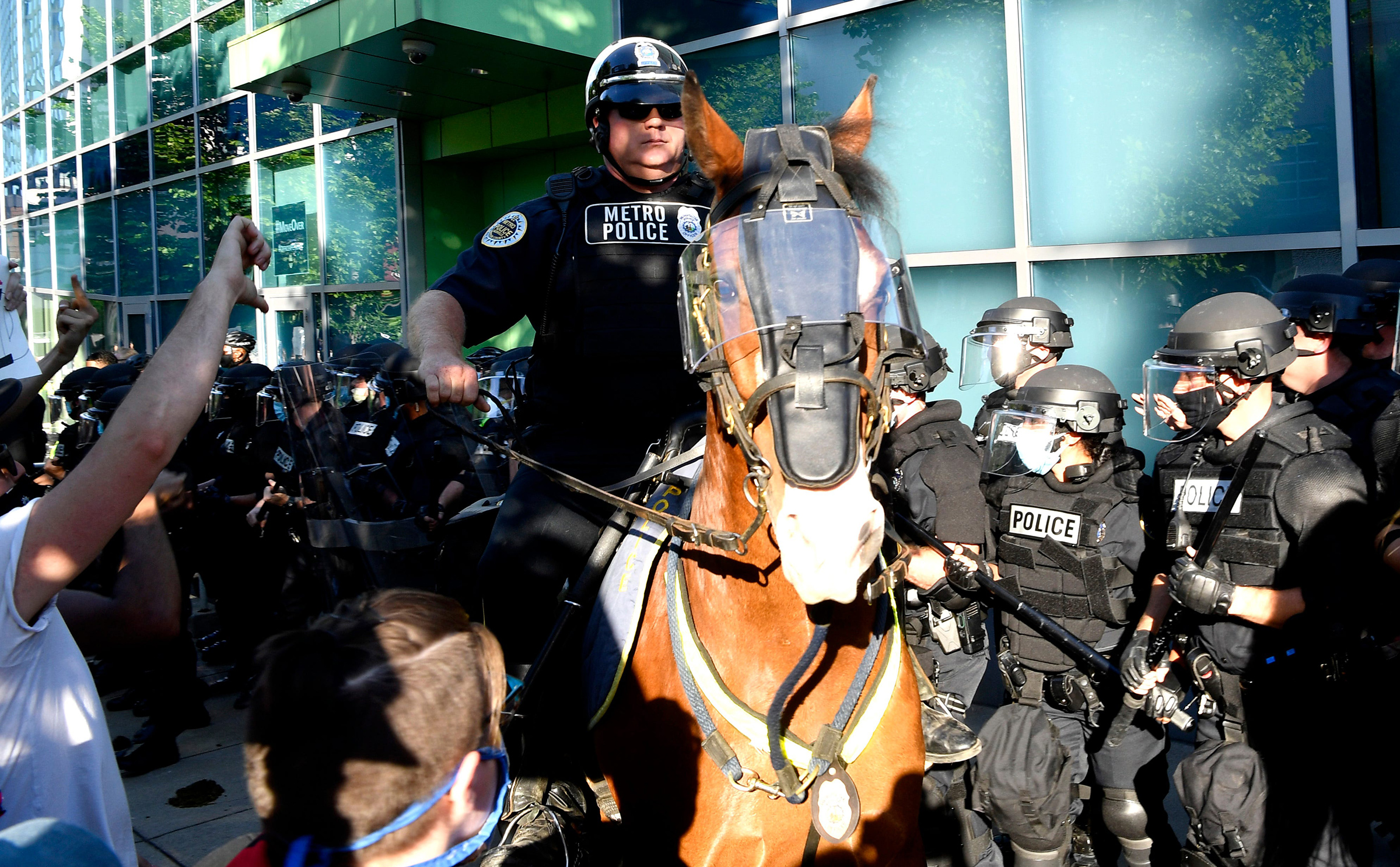 Police in riot gear and on horseback face off with protesters during a march in Nashville on May 30.