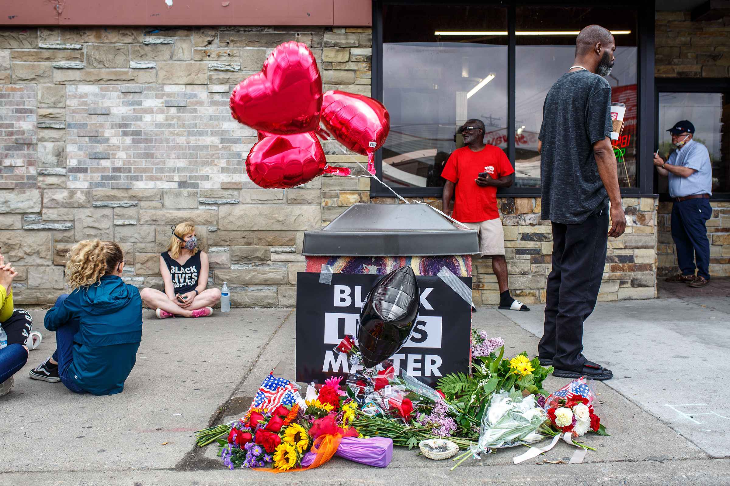A memorial left for George Floyd, at the scene where an officer pinned him down a day earlier, in Minneapolis on May 26. (Kerem Yucel—AFP/Getty Images)