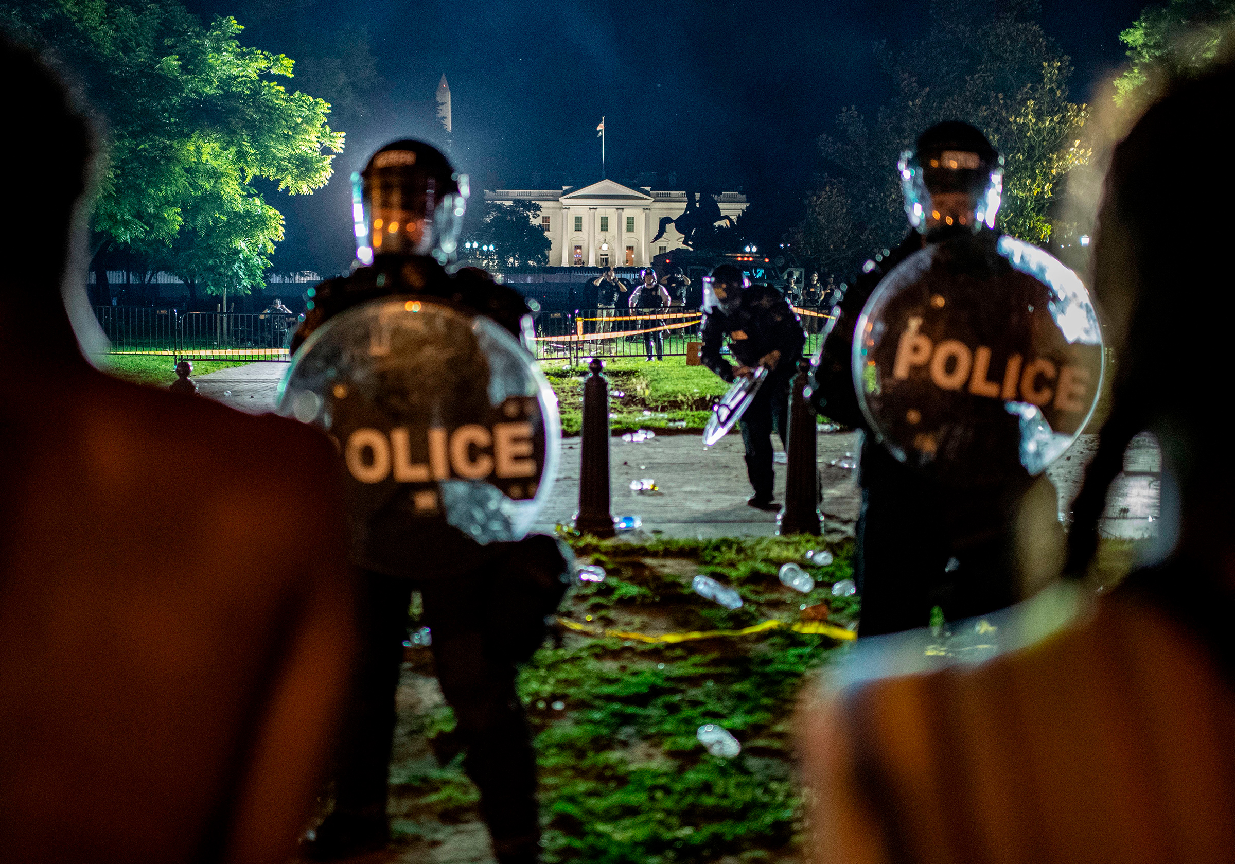Demonstrators confront U.S. Secret Service and Park Police officers outside the White House in Washington, D.C., on May 30, 2020. (Eric Baradat—AFP/Getty Images)