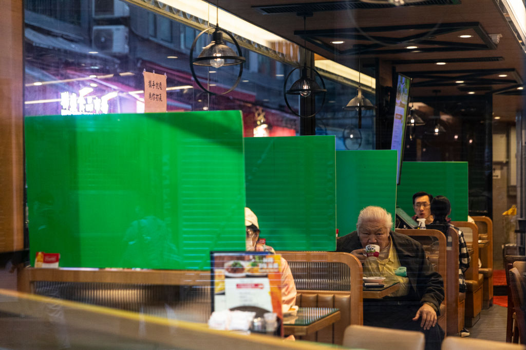 Plastic barriers enforcing social distancing measure seen in a restaurant during the coronavirus pandemic in Hong Kong on April 3, 2020. (Chan Long Hei&mdash;SOPA Images/LightRocket/Getty Images)