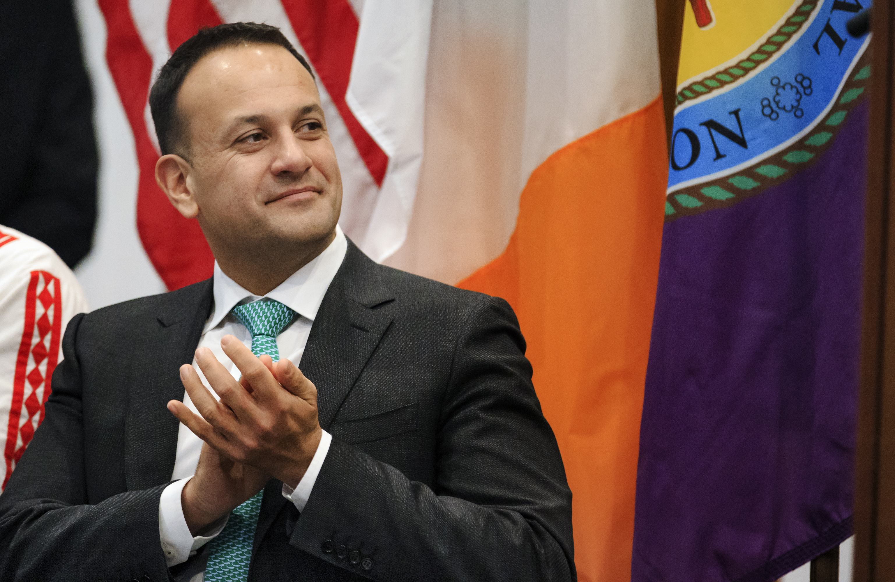 Ireland Prime Minister Leo Varadkar claps as he watches members of the Choctaw Tribe dance during his visit to the Choctaw Nation in Durant, Okla. on March 12, 2018. (Chris Landsberger—The Oklahoman/AP)