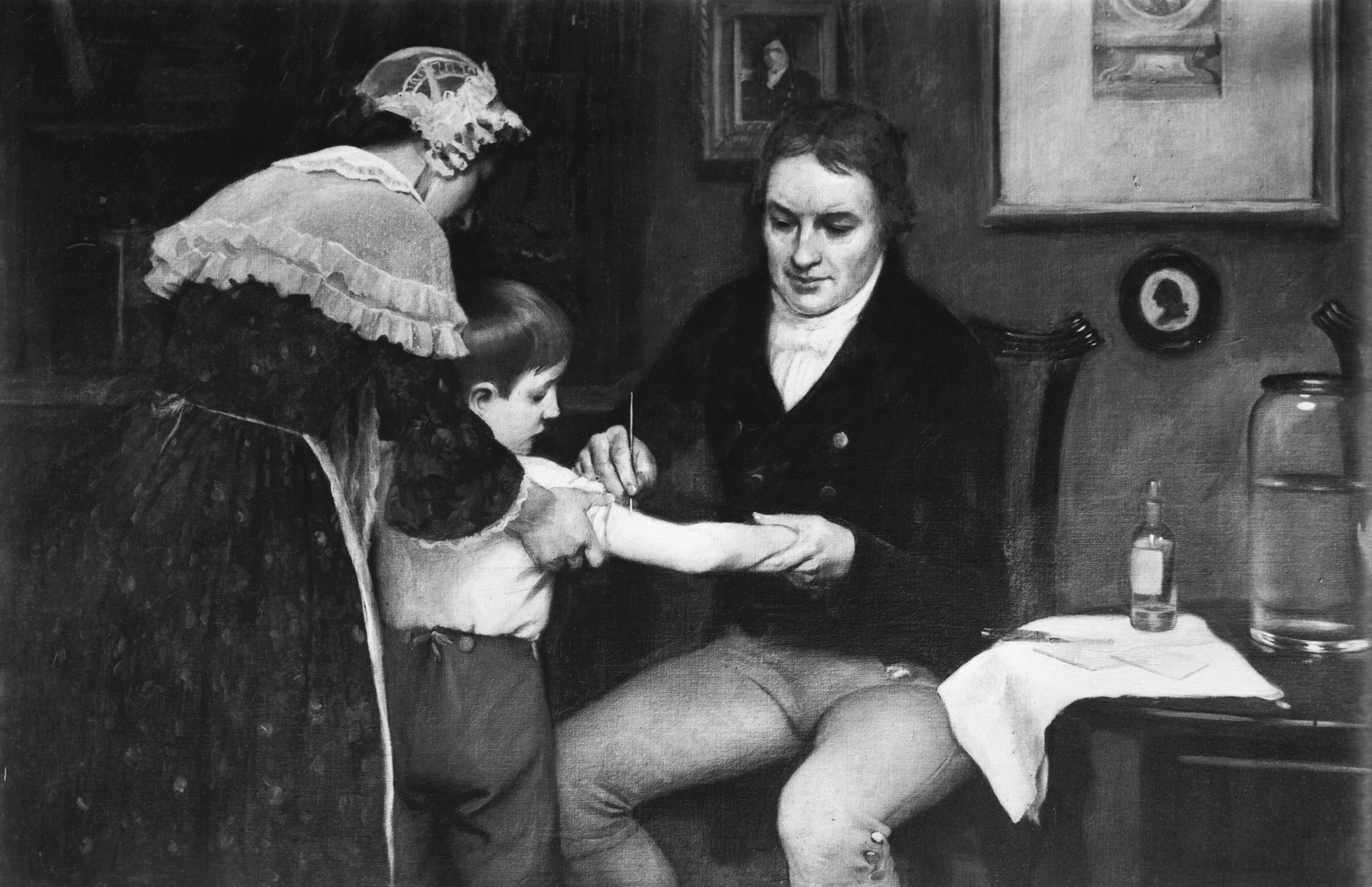 Dr. Edward Jenner (1749-1823) performing his first vaccination on James Phipps on May 14, 1796. Painting by E. Board in the Welcome Museum, London. Undated painting. (Bettmann Archive/Getty Images)