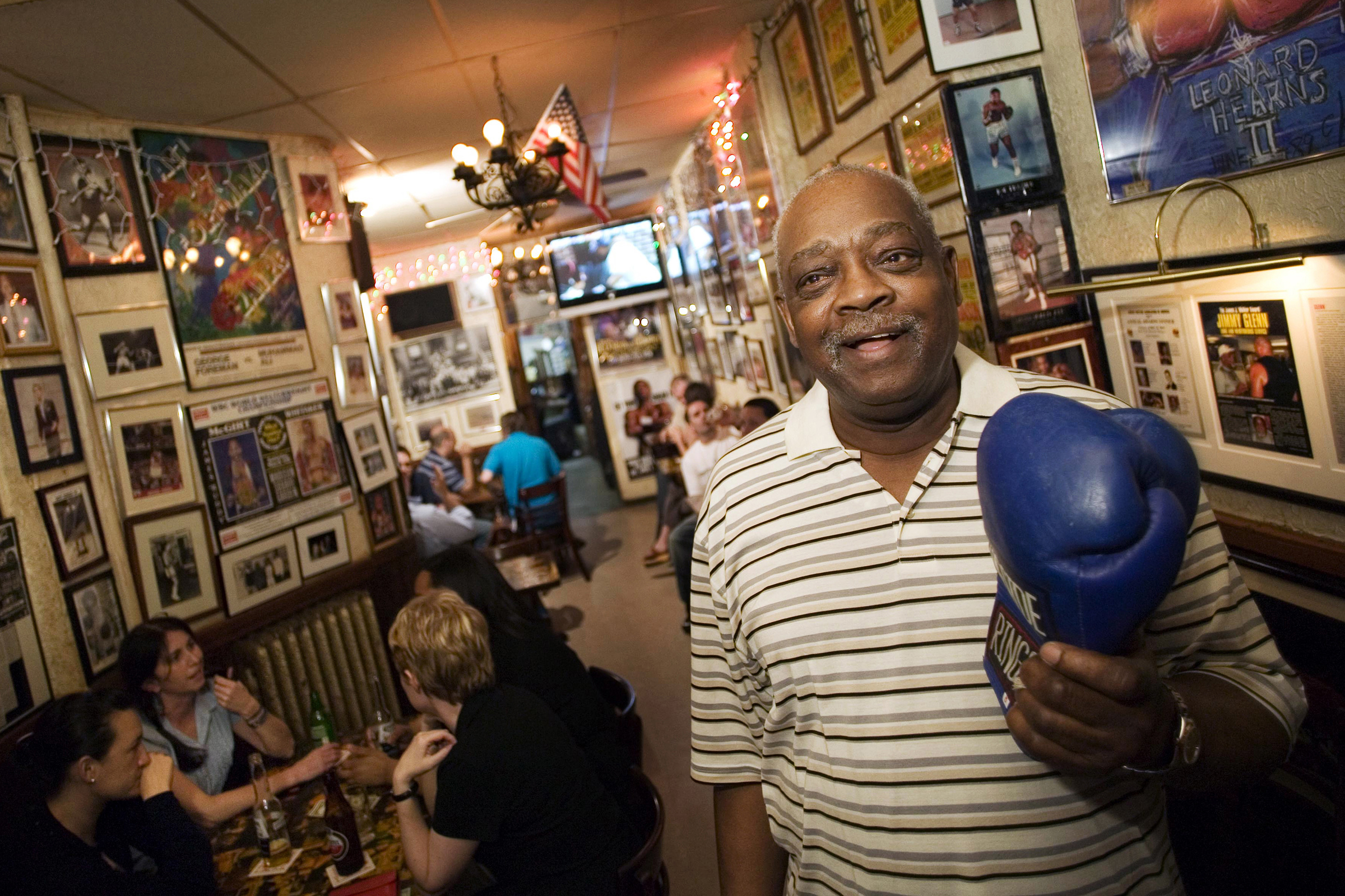 This image is also in Merlin with ID 14758717. Jimmy Glenn, a boxing trainer and owner of Jimmy's Corner, at the restaurant in New York, Aug. 4, 2006. (Piotr Redlinski/The New York Times)