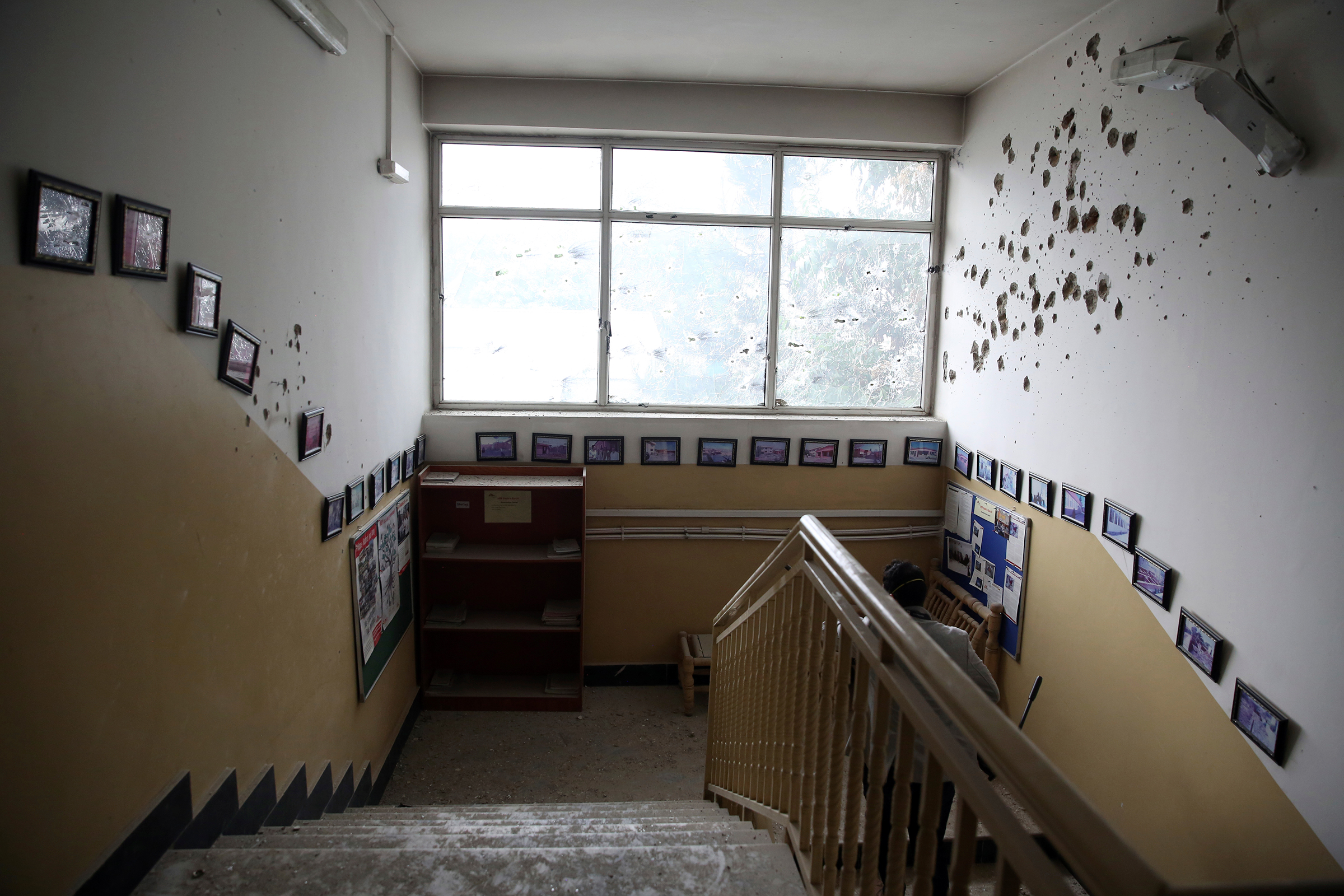 Bullet holes line the wall of the maternity hospital, after gunmen stormed the facility, in Kabul on May 12.