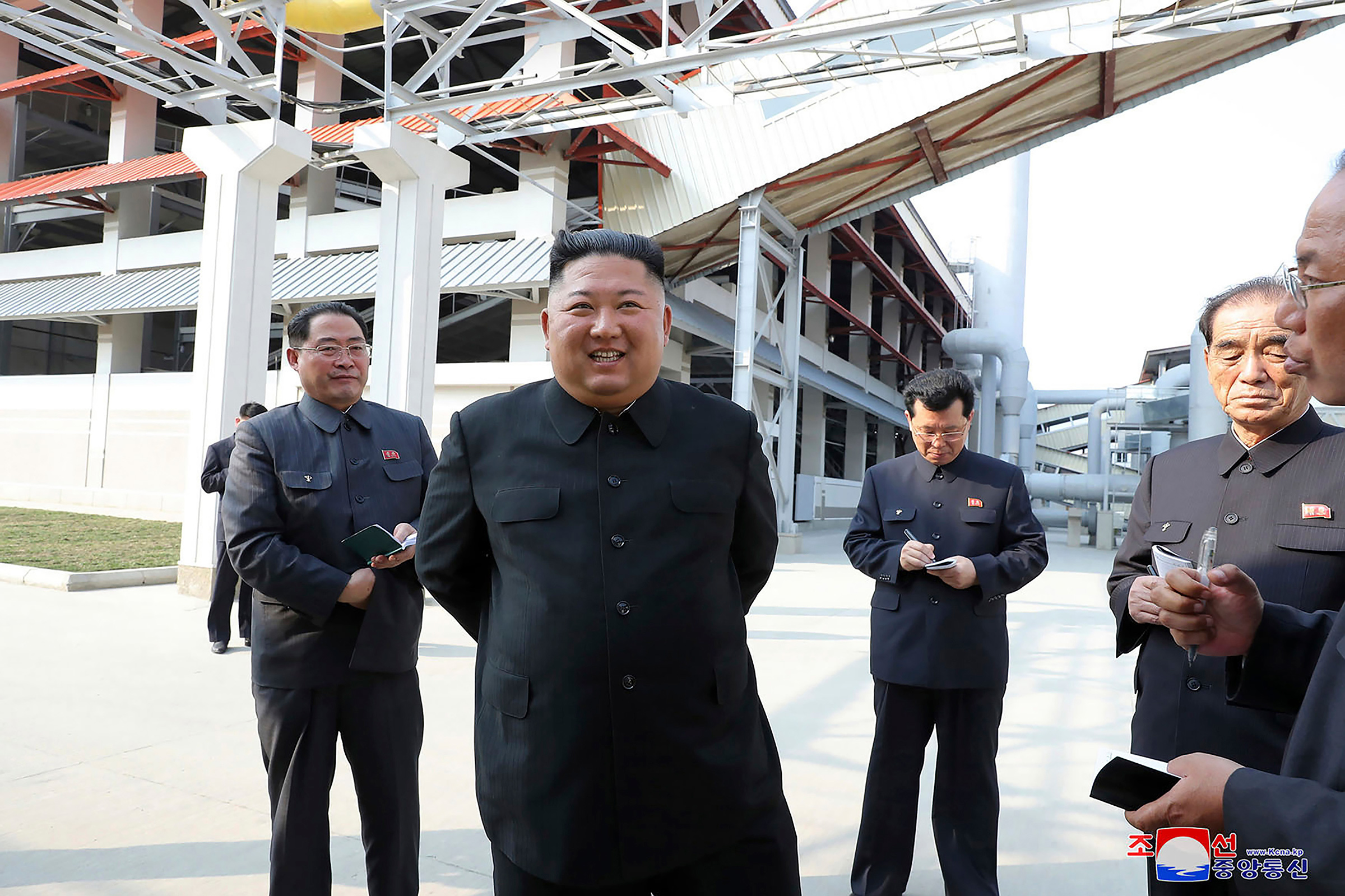 In this Friday, May 1 photo provided by the North Korean government, North Korean leader Kim Jong Un, center, visits a fertilizer factory in Sunchon, South Pyongan province, near Pyongyang. (Korean Central News Agency/AP)