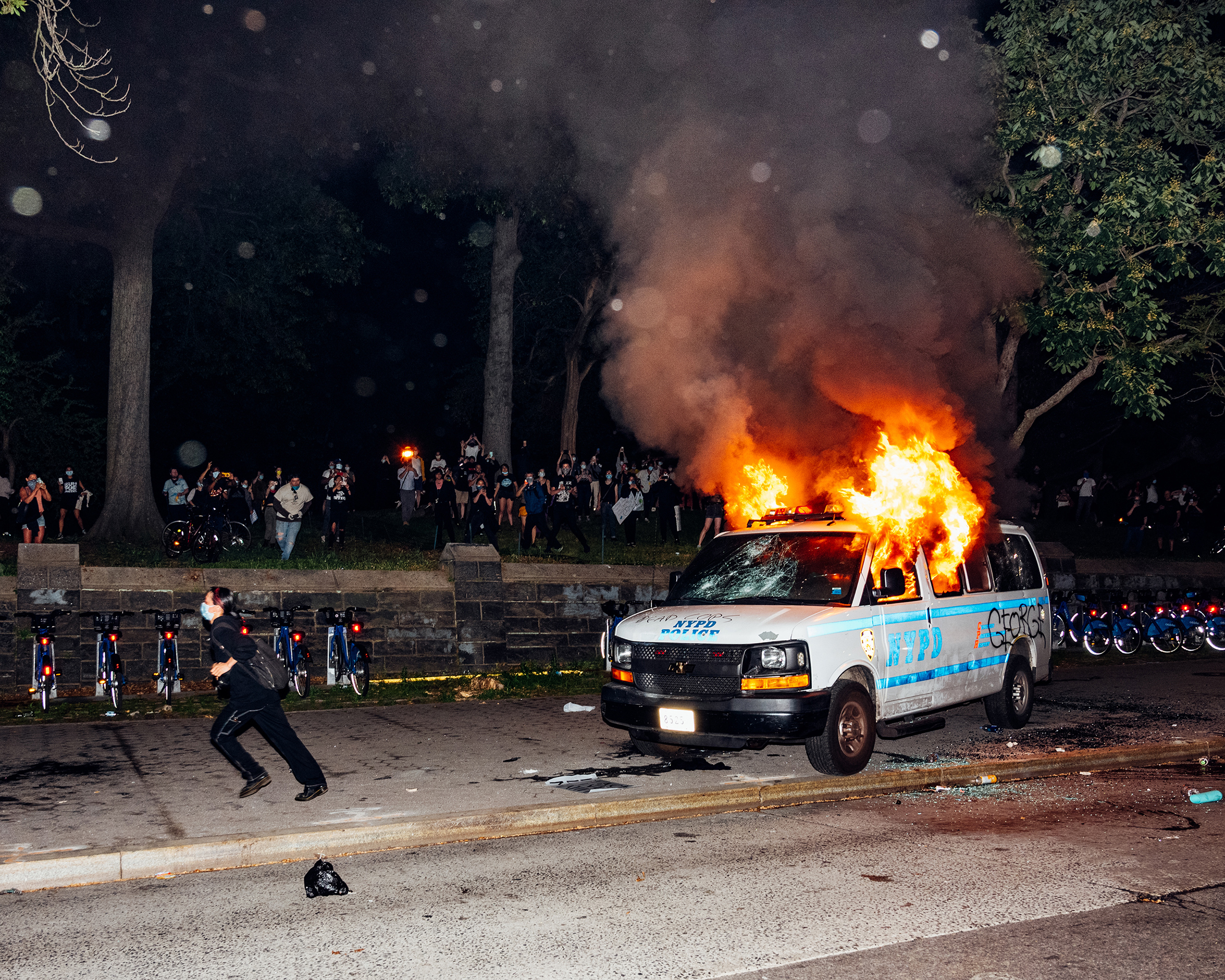 An NYPD van burns next to Fort Greene Park.