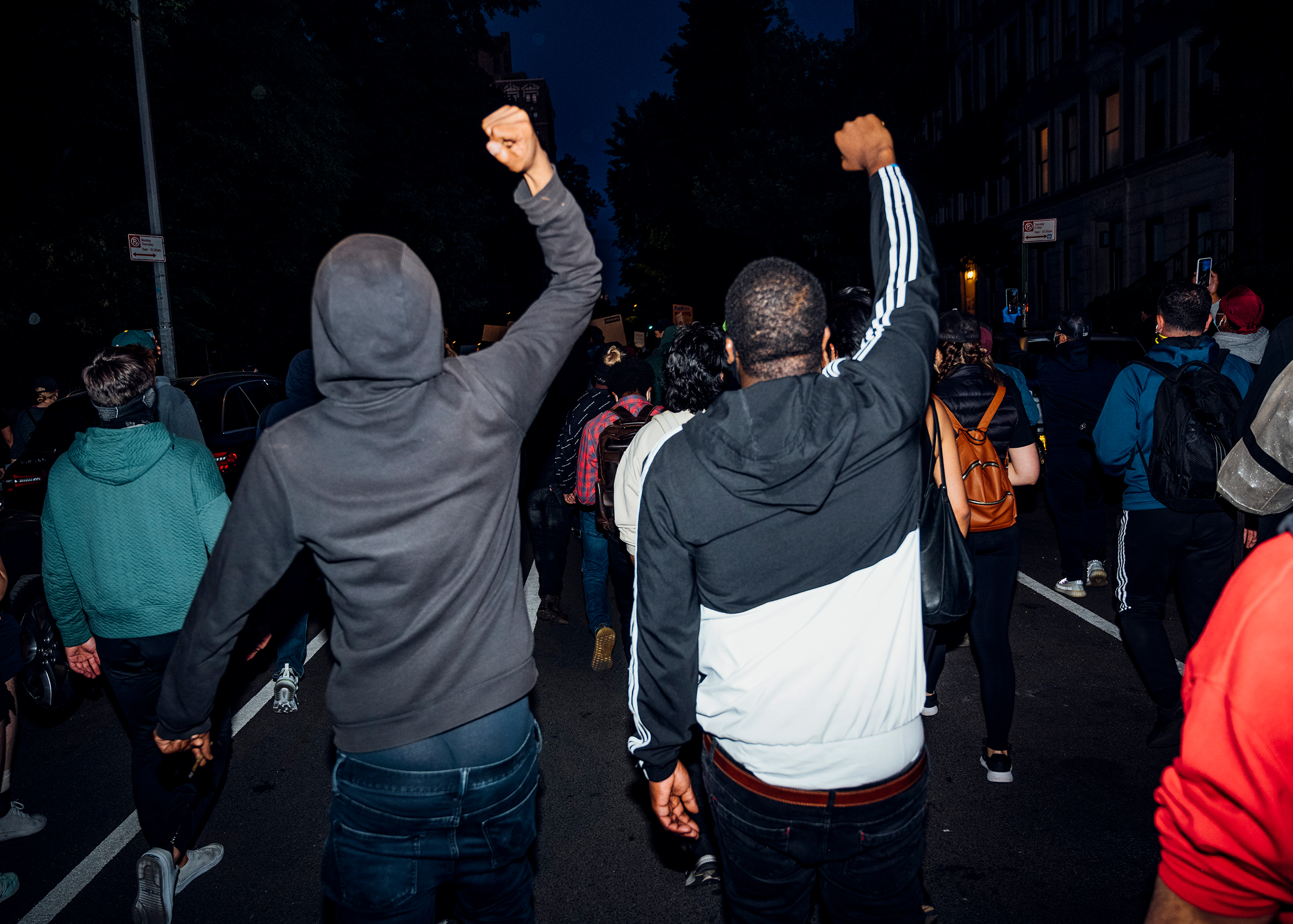 Two men walk during a peaceful demonstration on the west side of Manhattan on May 31.