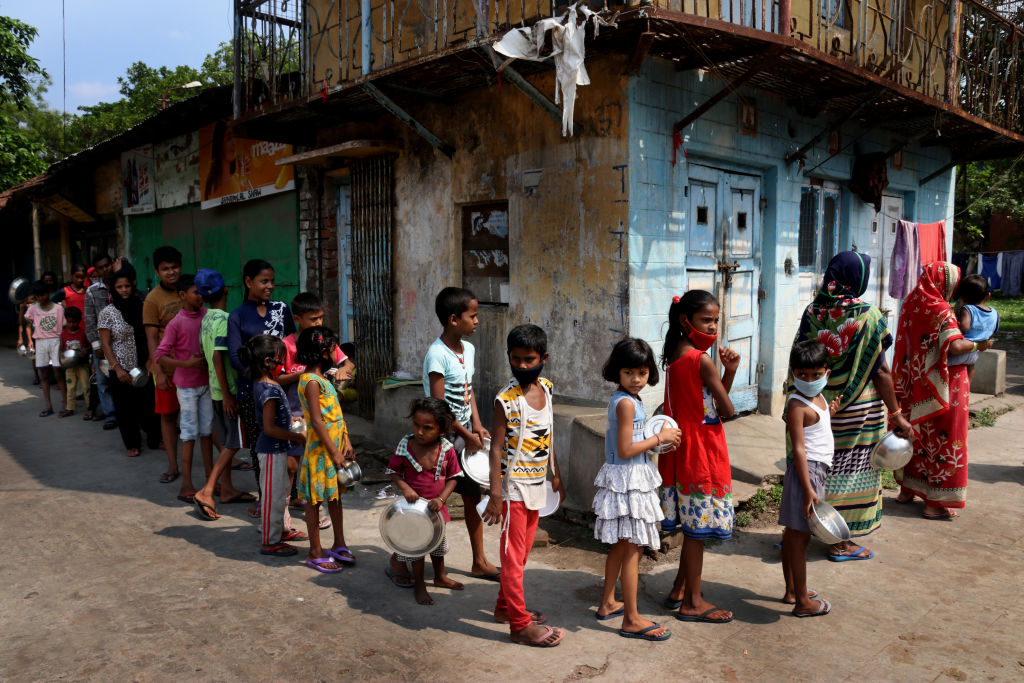 People line up to receive free food distributed by a Hindu group during a government-imposed nationwide lockdown as a preventive measure against the COVID-19 coronavirus, in Kolkata, India on April 25, 2020. (Debajyoti Chakraborty&mdash;NurPhoto/Getty Images)