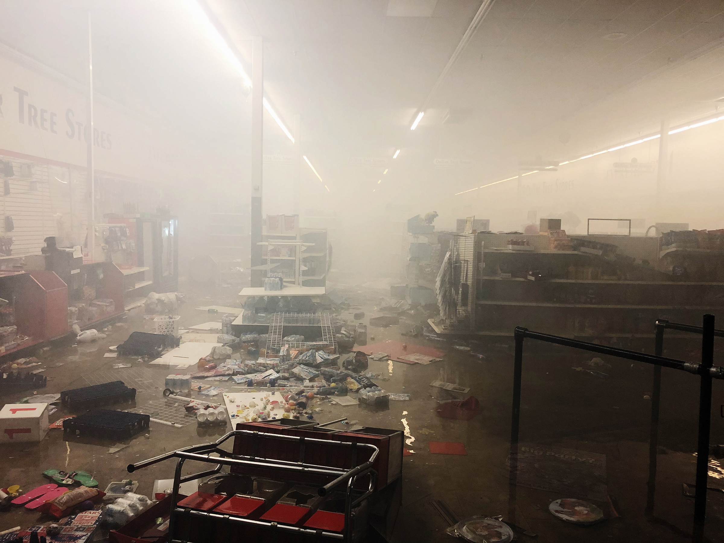 The remains of a Dollar Tree store smolders after protests in Minneapolis on May 28, 2020.